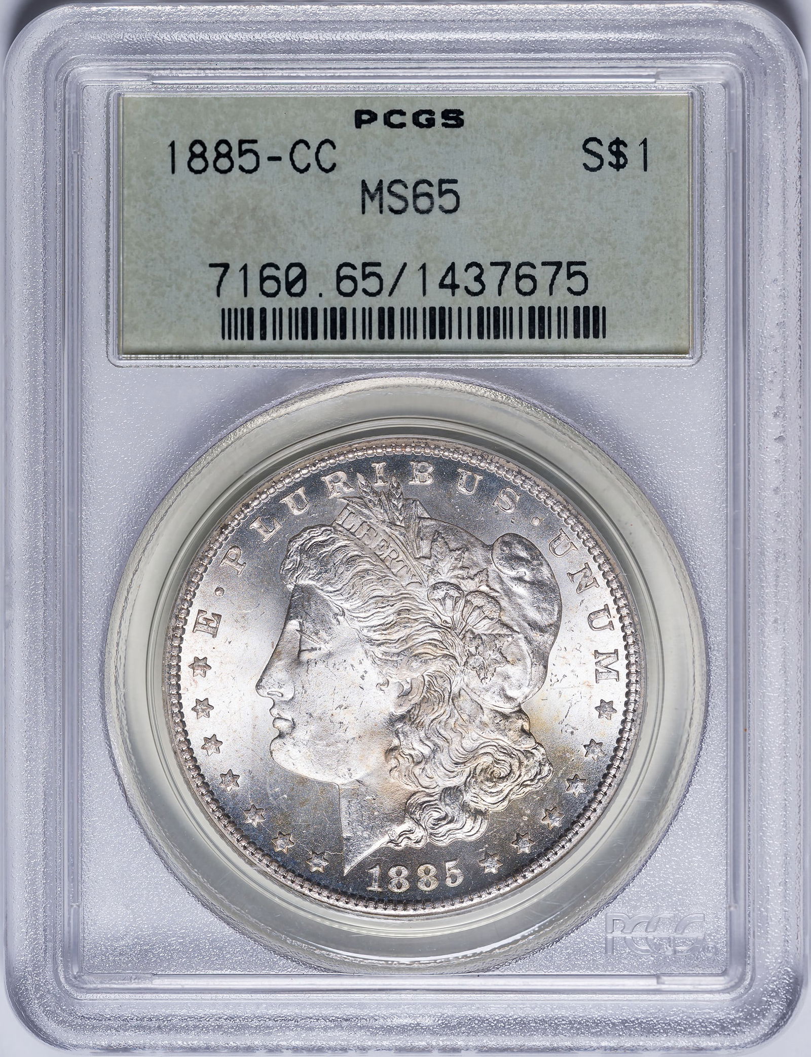 PCGS MS-65 1885-CC Morgan Dollar: An exceptional Gem at every turn. Brilliant, sharp, and lustrous. In an old-style green label PCGS holder with plastic frame.