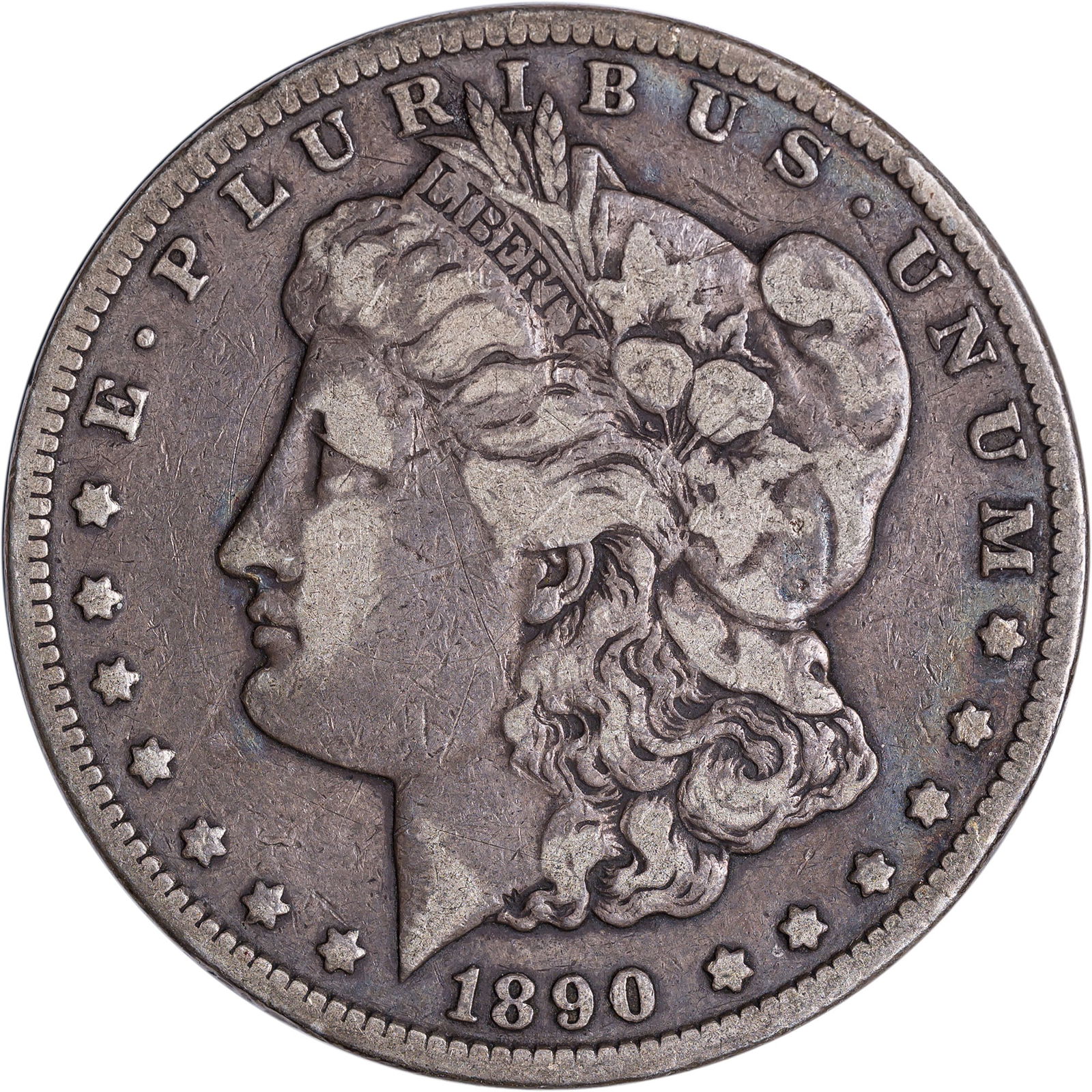 Fine-12 1890-CC Morgan Dollar: Deep lilac-gray with excellent eye appeal in spite of a tiny rim bump on each side.