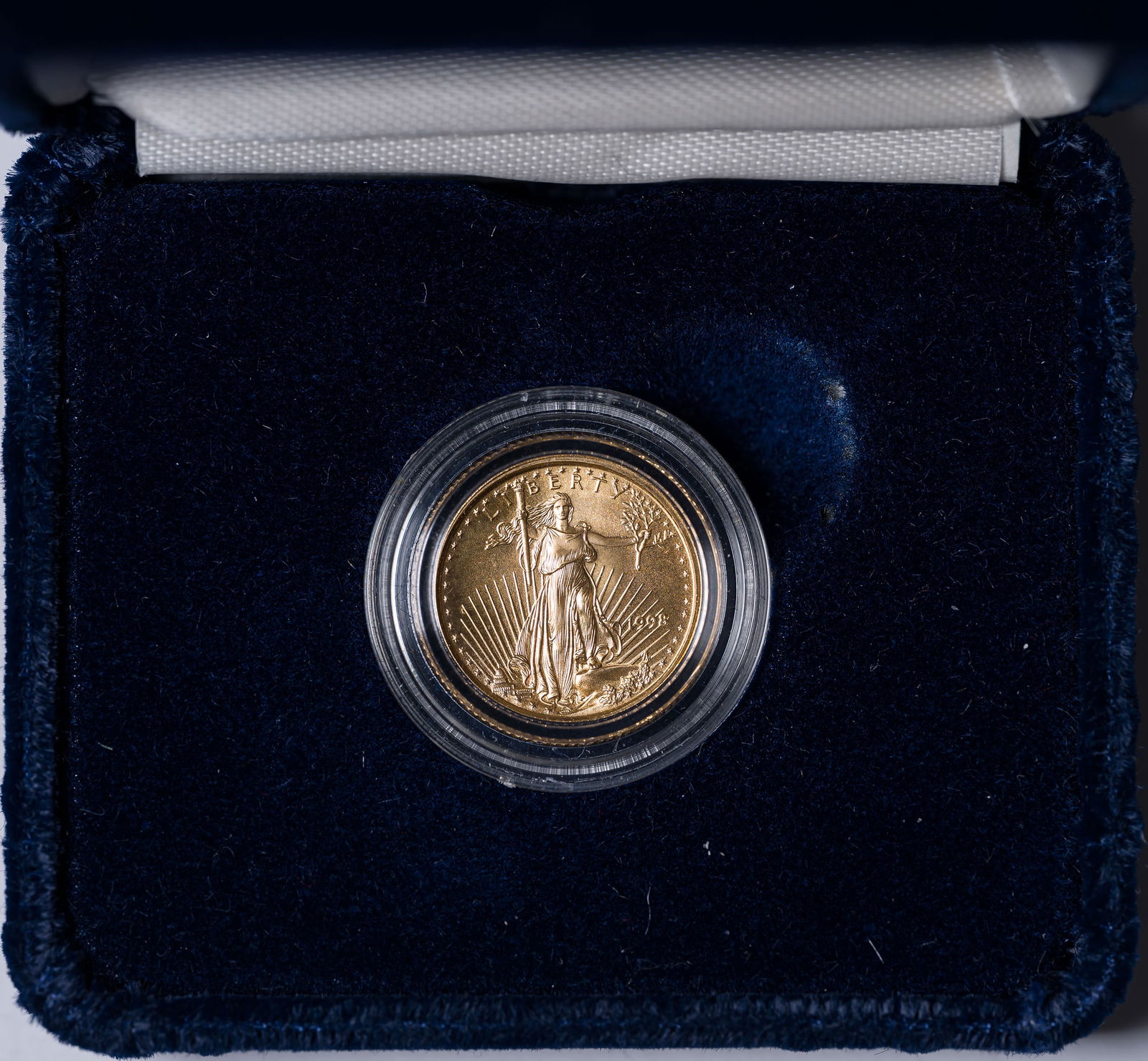 Gem BU 1998 1/10 Ounce Gold Eagle: Housed in a deluxe case.