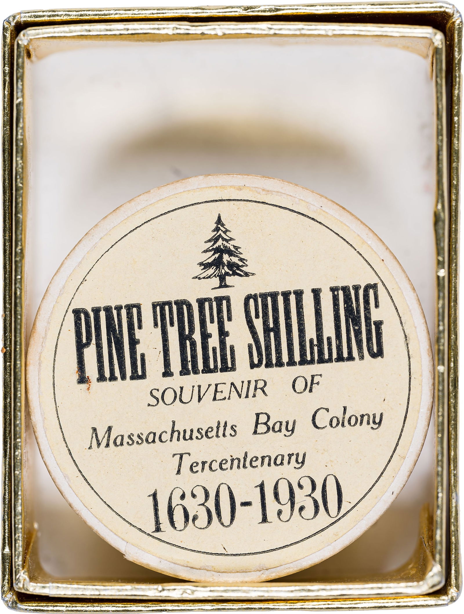 Massachusetts. Souvenir Pine Tree Shilling: Massachusetts Bay Colony Tercentenary 1630-1930 token. White metal. In box of issue with original paperwork. Seldom seen this complete.