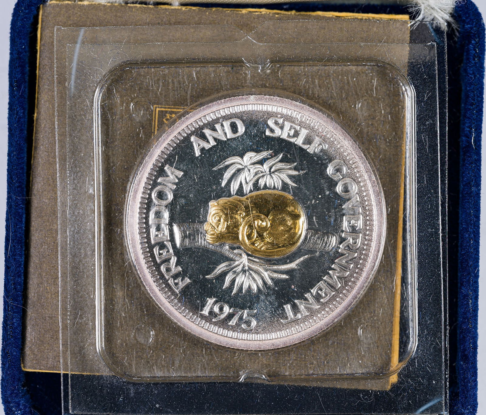 Solomon Islands. Gem As Struck 1975 $3: Struck in silver and gold. Limited strike: 40,000 pieces. According to the accompanying paperwork, "Each coin is guaranteed to contain not less than 5 grains pure 24K gold and 24 grams .999 silver,"