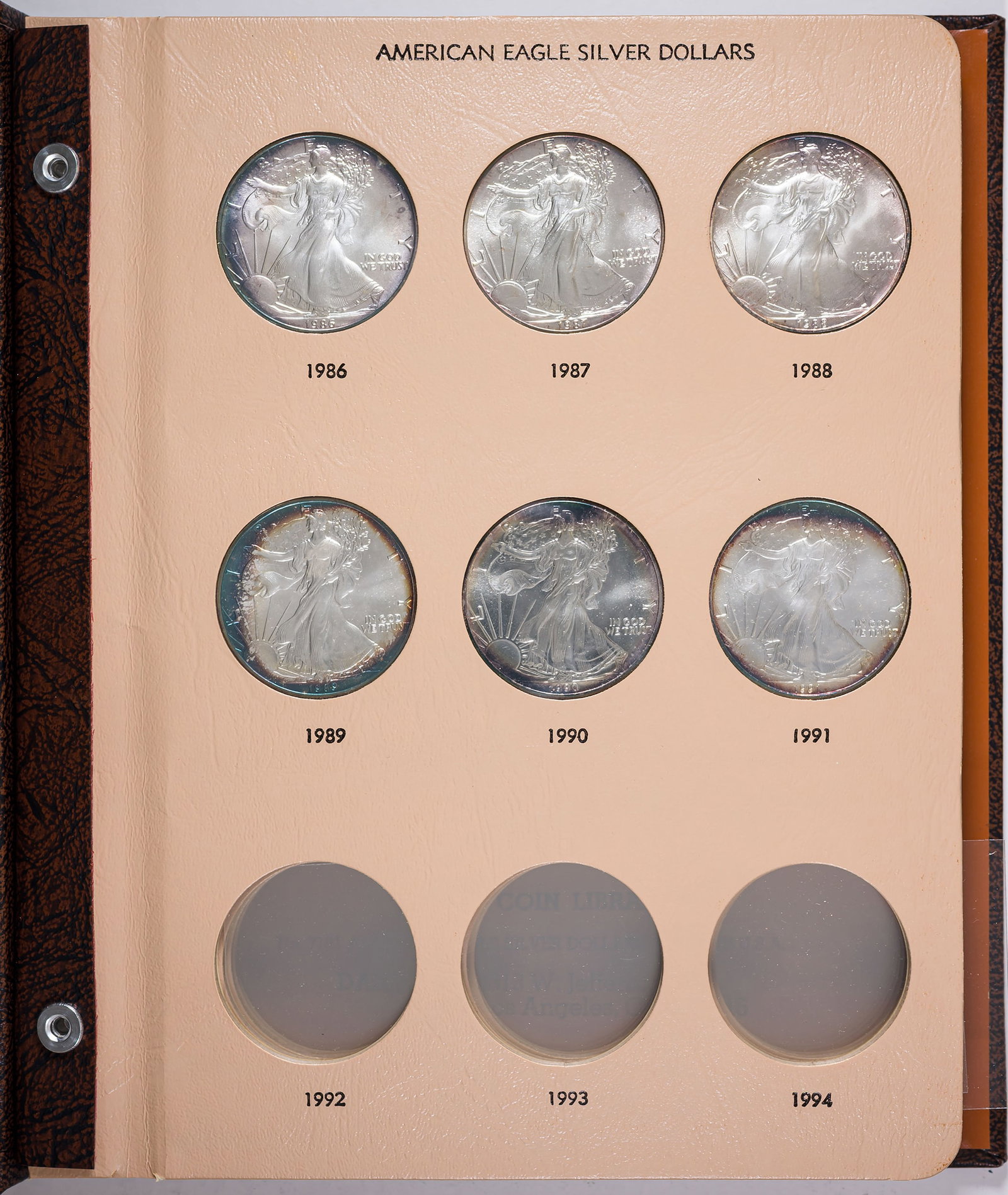 Gem 1986-91 Silver Eagles: Superb gem examples of the first 6 Silver Eagle issues. Each has some edge toning which is particularly nice on the 1989. Housed in a Dansco album. (Total: 6 pieces)