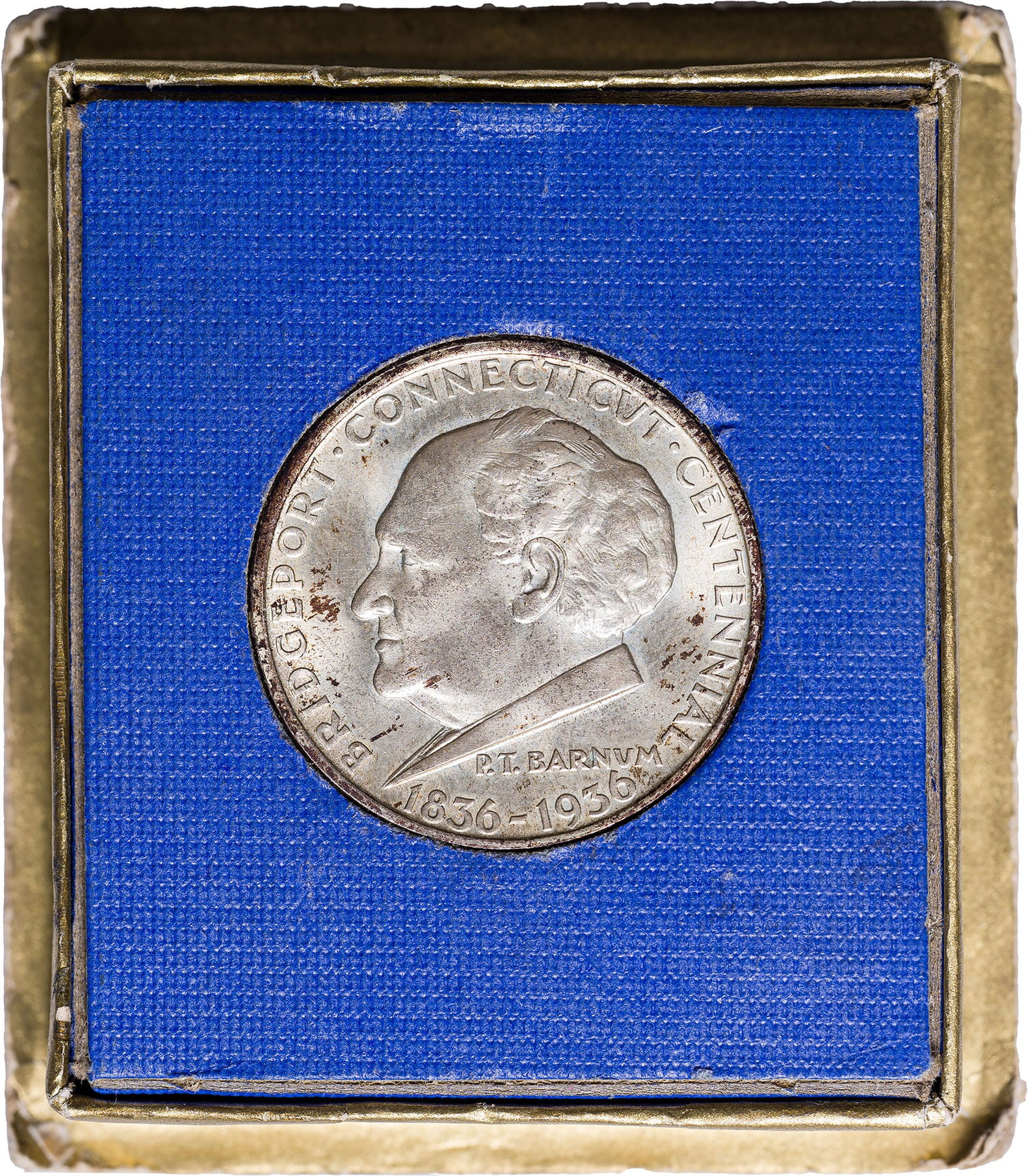 Gem BU-65 1936 Bridgeport Half Dollar: An original gem still housed in its original box as issued.
