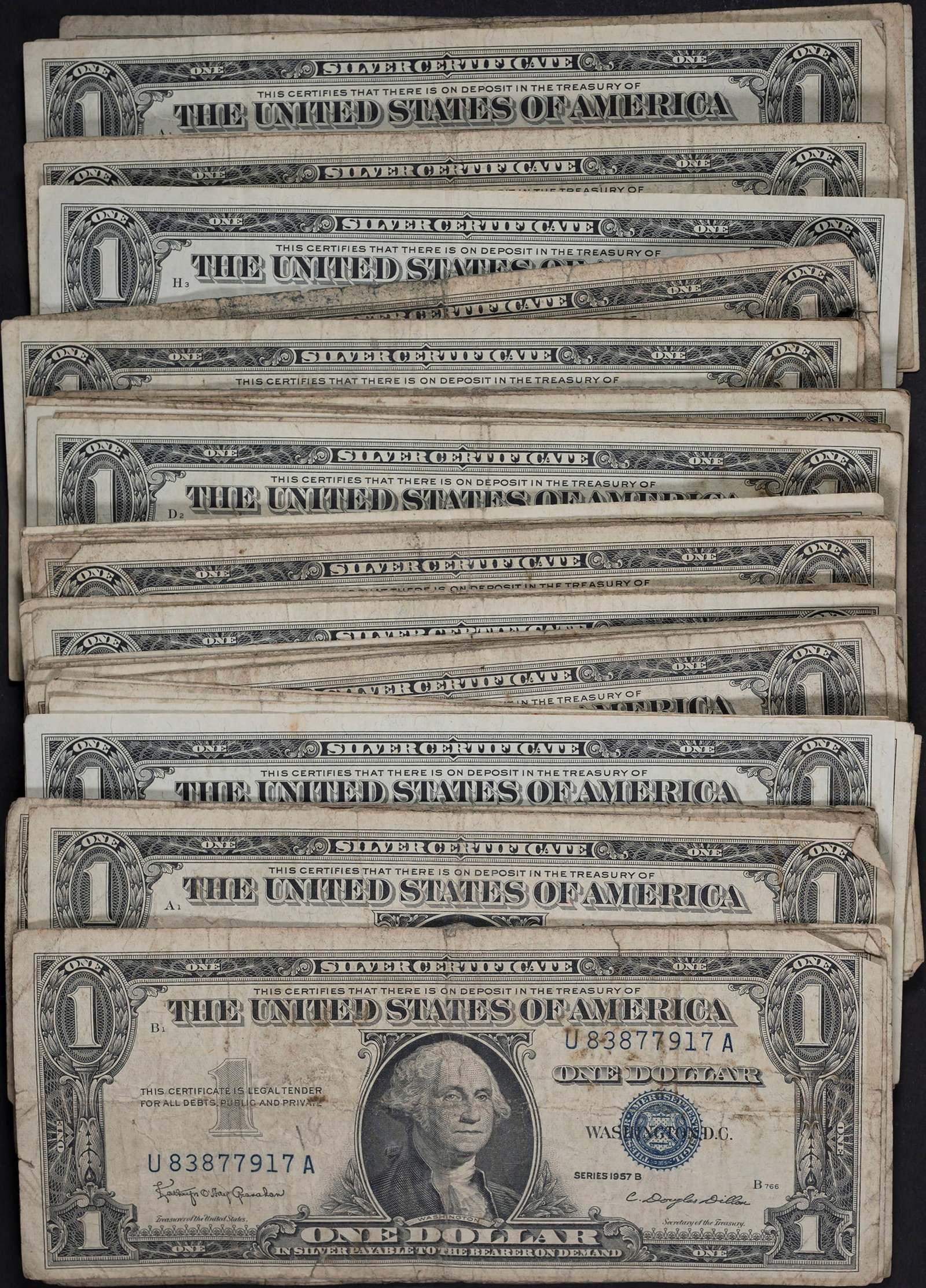 Smaller Hoard 1957-B $1 Notes: Average circulated. (Total: 64 pieces)