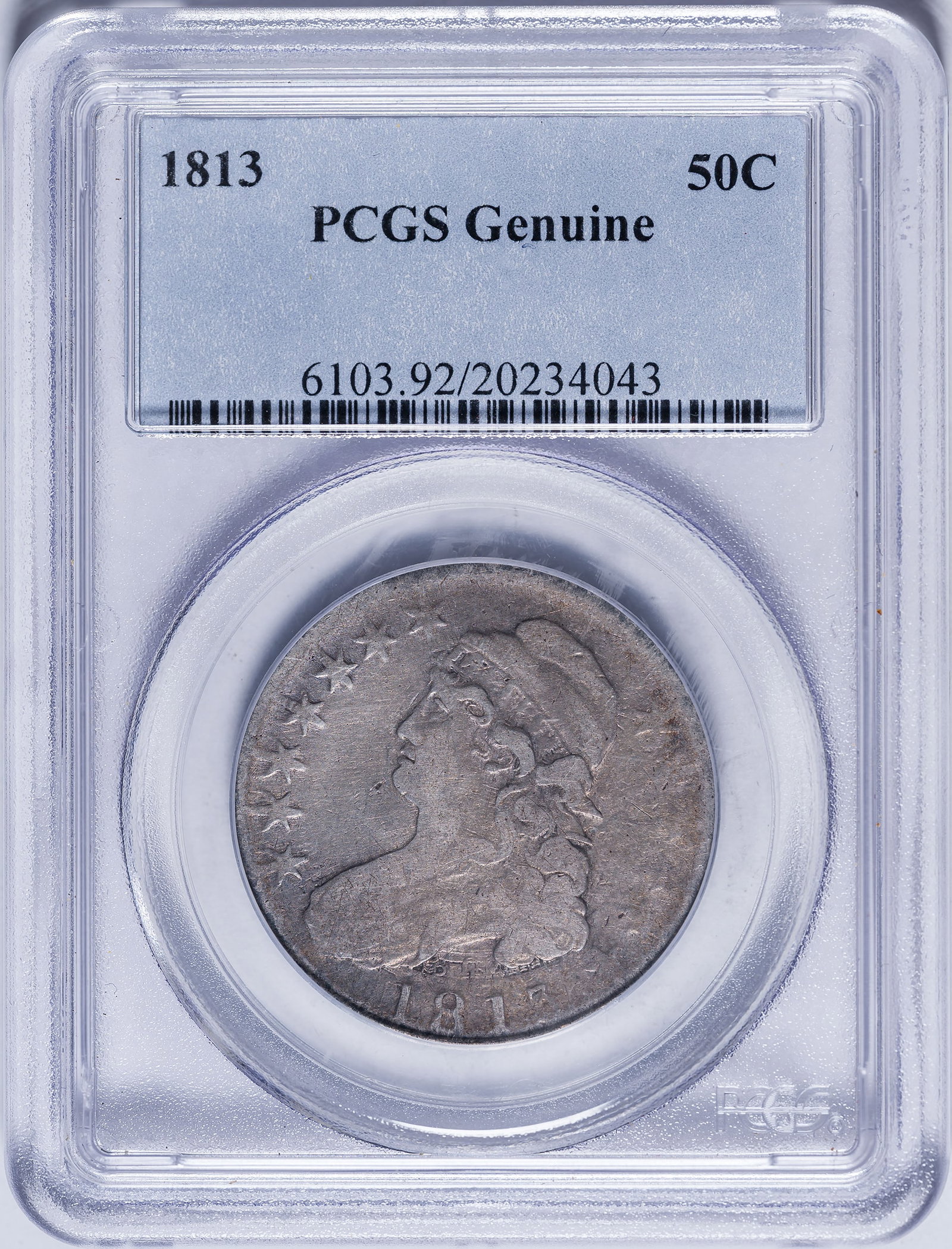 PCGS Genuine 1813 Half Dollar: Overall F-12. Variety with heavy die clash below and around the tip of Liberty's bust. Medium silver-gray.