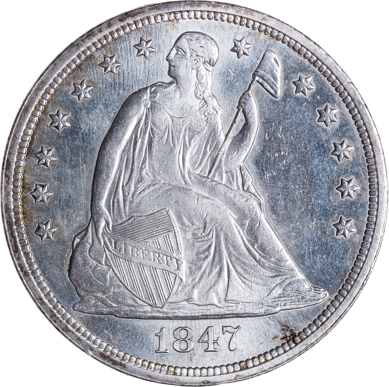 AU-58 Details 1847 Liberty Seated Dollar: The surfaces were the recipient of a brushing or light whizzing, but to no great visual distraction. An attractive and worthwhile coin in spite of itself.