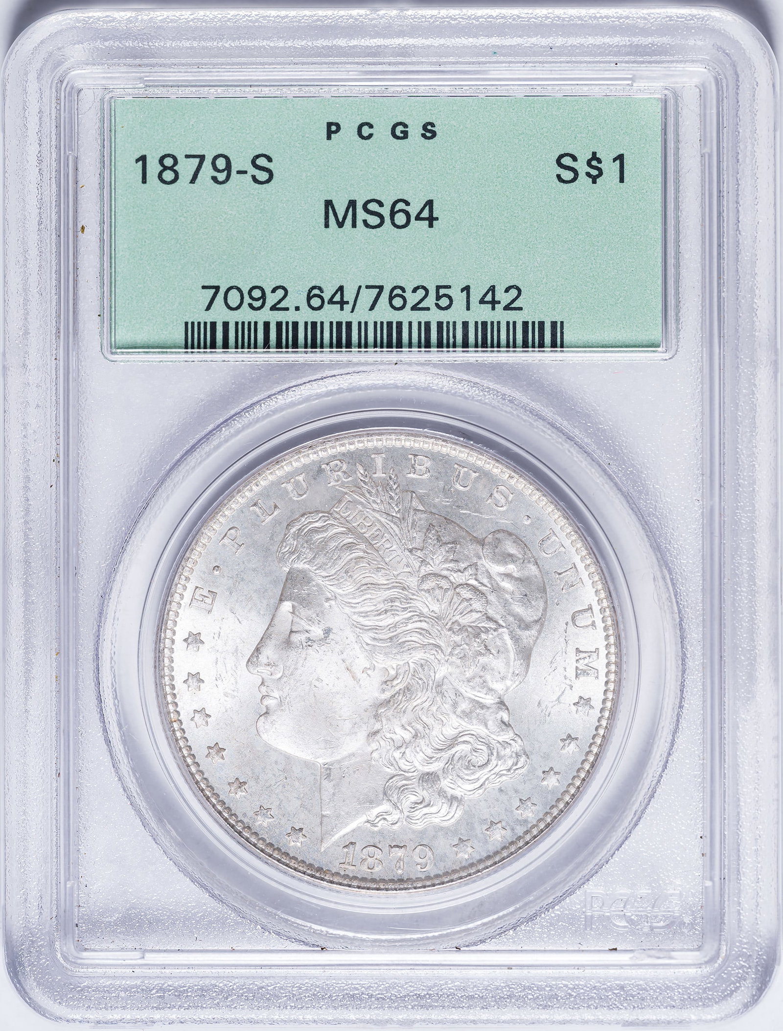 PCGS MS-64 1879-S Morgan Dollar: Frosty and mattelike with golden toning and lively cartwheel luster. In an old-style green label PCGS holder with plastic frame.