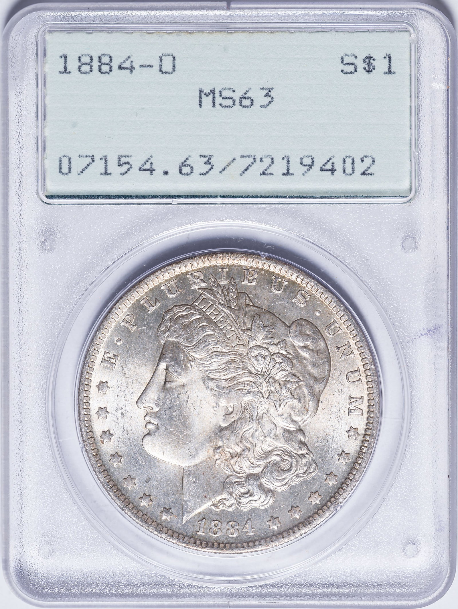 PCGS MS-63 1884-O Morgan Dollar: Satiny and lustrous with a whisper of golden toning. In an old-style green label PCGS "Rattler" holder.