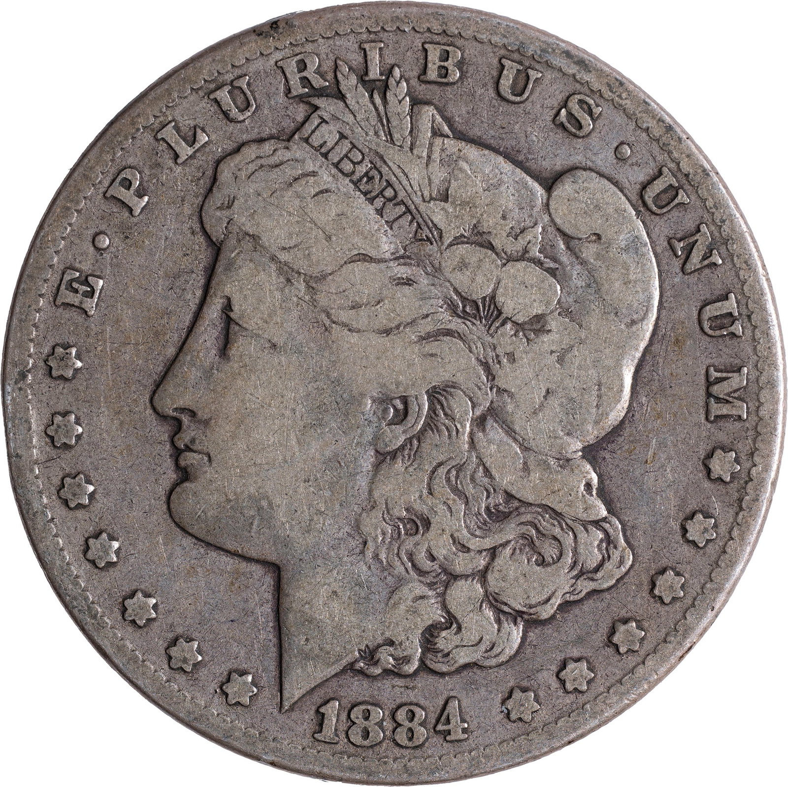 Fine-12 1884-CC Morgan Dollar: Evenly worn but not noticeably marked pale golden-gray surfaces.