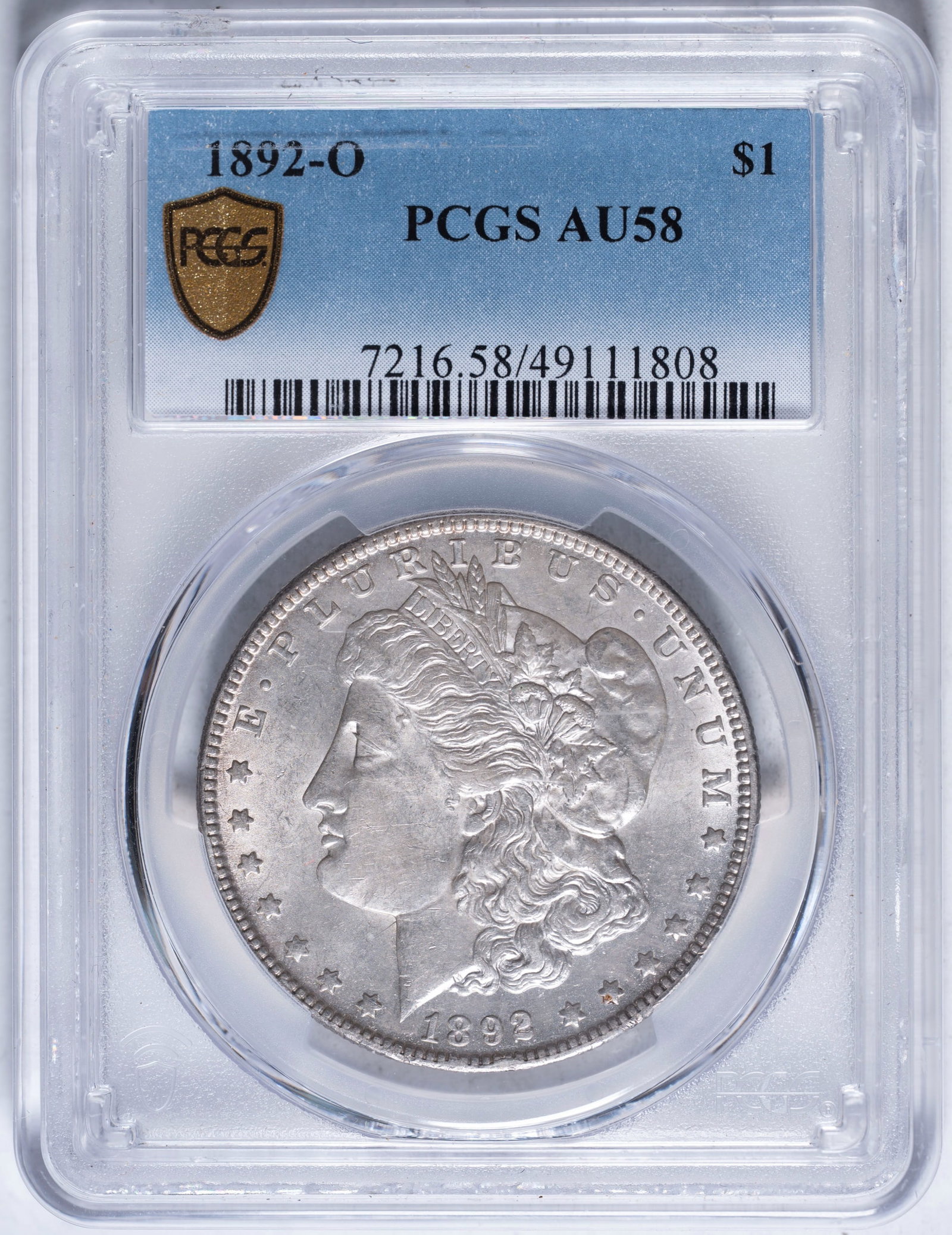 PCGS AU-58 1892-O Morgan Dollar: Lustrous with a hint of tone. Not noticeably worn.