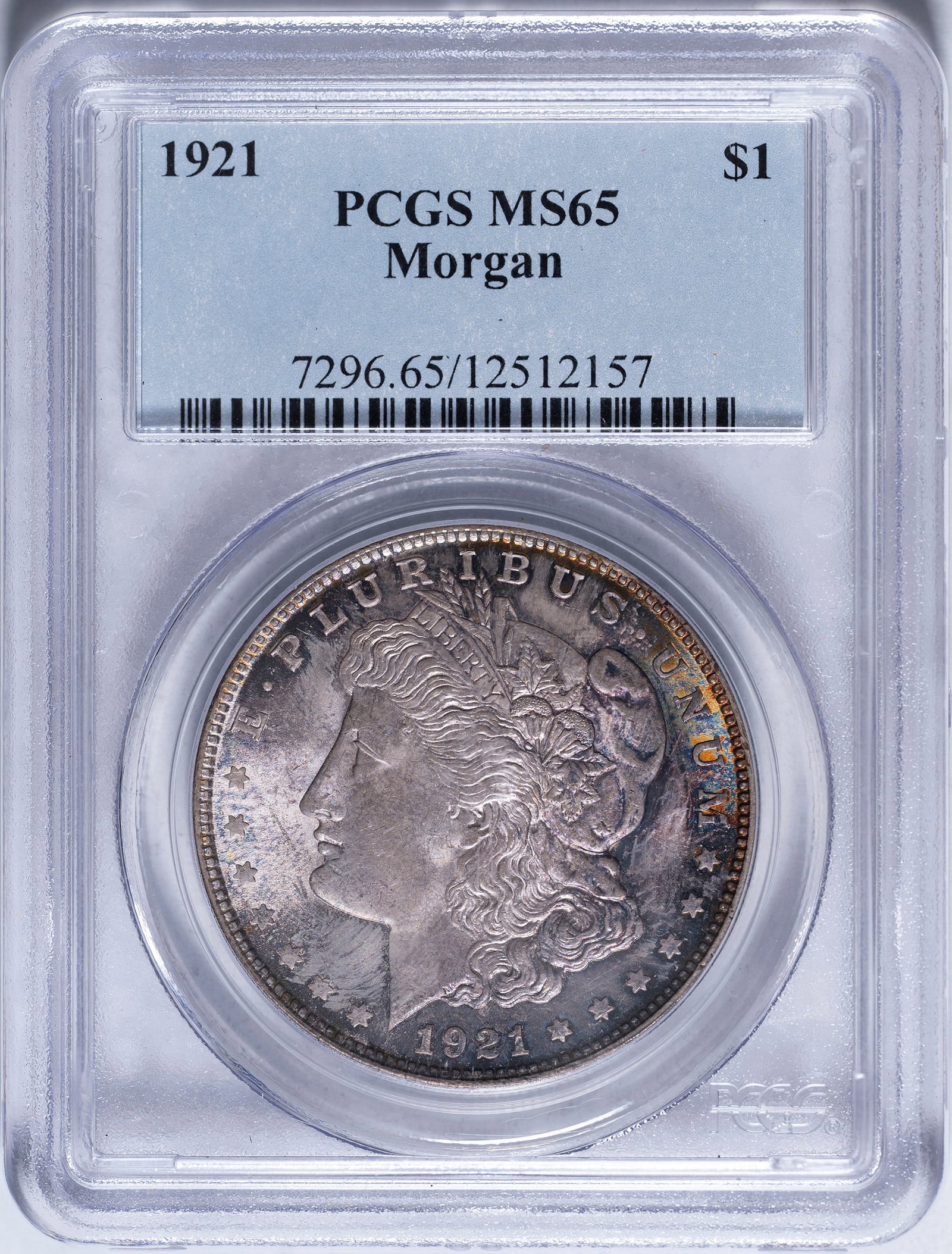 Toned PCGS MS-65 1921 Morgan Dollar: This gem shows a colorful pastel tone with purple and mauve hues.