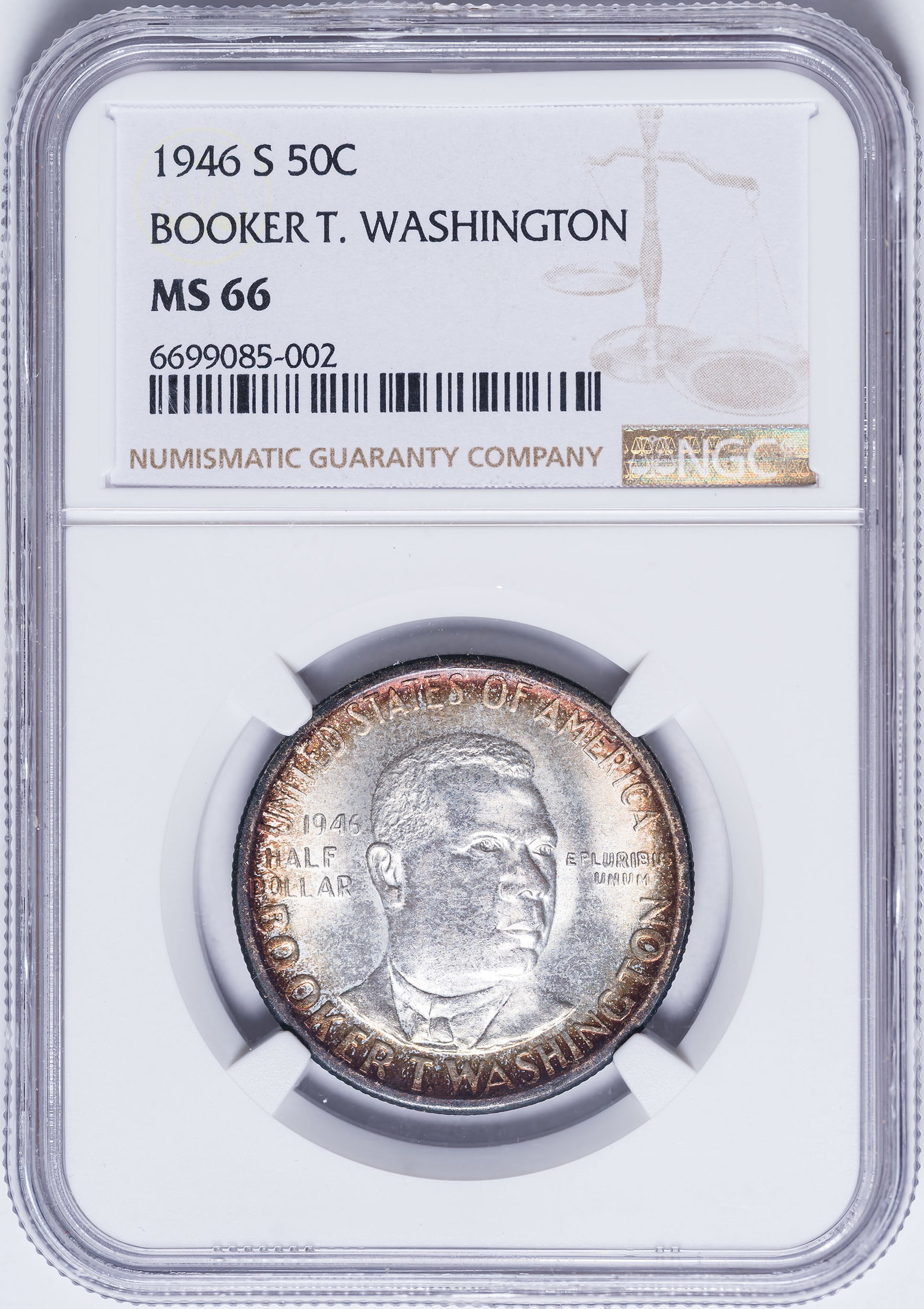 NGC MS-66 1946-S B.T. Washington Half Dollar: Lustrous and brilliant at the obverse center, with a halo of vibrant crimson iridescence at the rim. The reverse exhibits smoky orange toning.