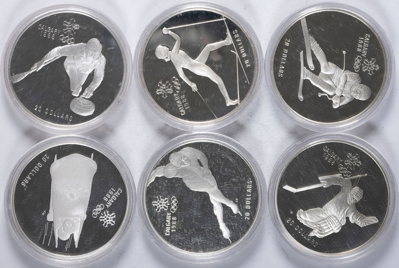 Canada. 6 Diff 1988 Calgary Olympics Silver $20: Dated from 1985-87 Each of these gem sterling silver coins contains just over one ounce of pure silver. Each is in its original mint capsule. (Total: 6 pcs)