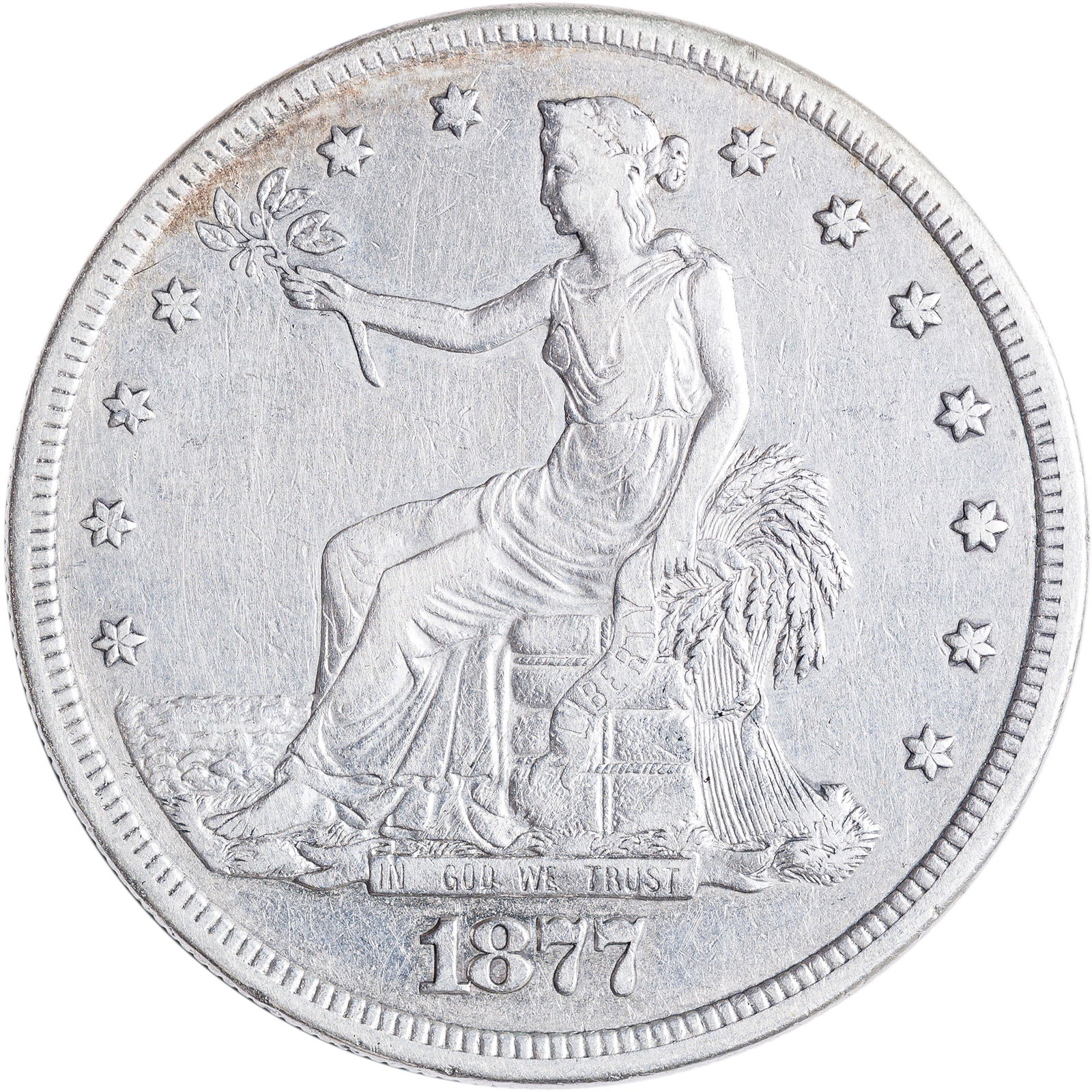 VF+ 1877-S Trade Dollar: Medium silver-gray with a hint of golden frost.