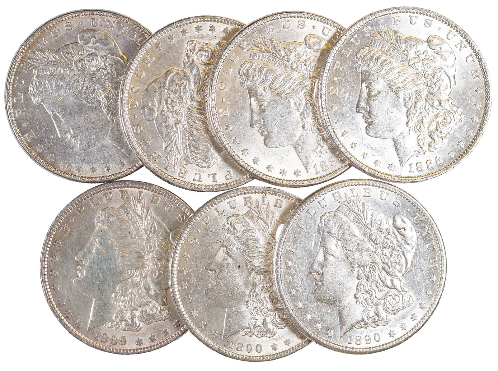 7 Different AU Morgan Dollars: Includes 1878 7F, 1883, 1885, 1888, 1889, 1890 & 1890-S. All grade AU-50 or better with a few showing signs of a light cleaning. (Total: 7 pcs)