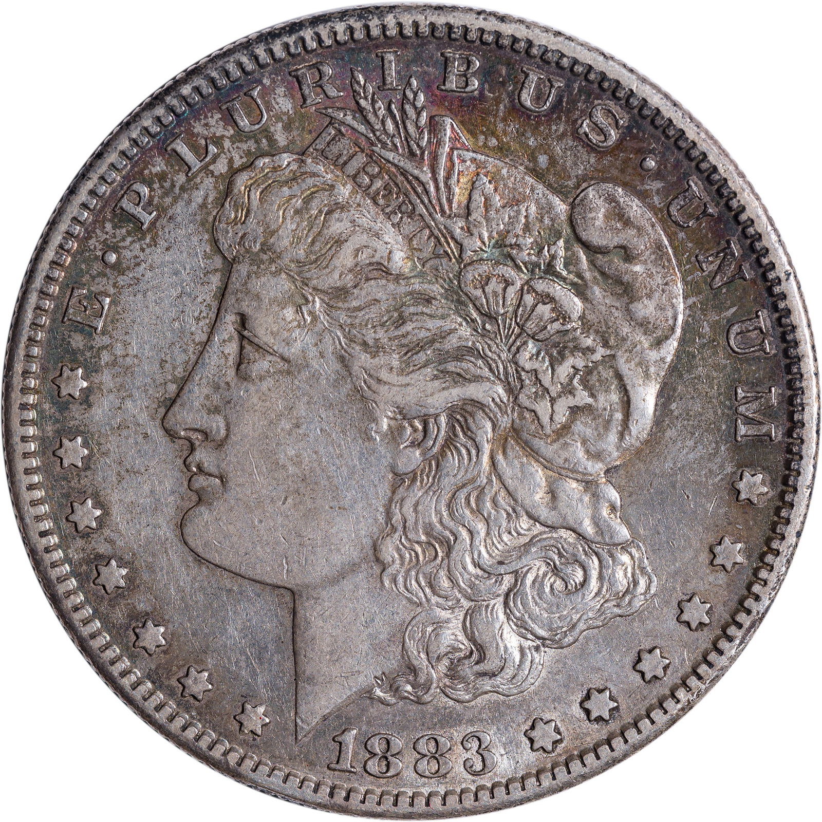 AU-50 Toned 1883-S Morgan Dollar: Mark-free steel-gray surfaces enjoy a wealth of deeply varied rainbow toning at the rims.