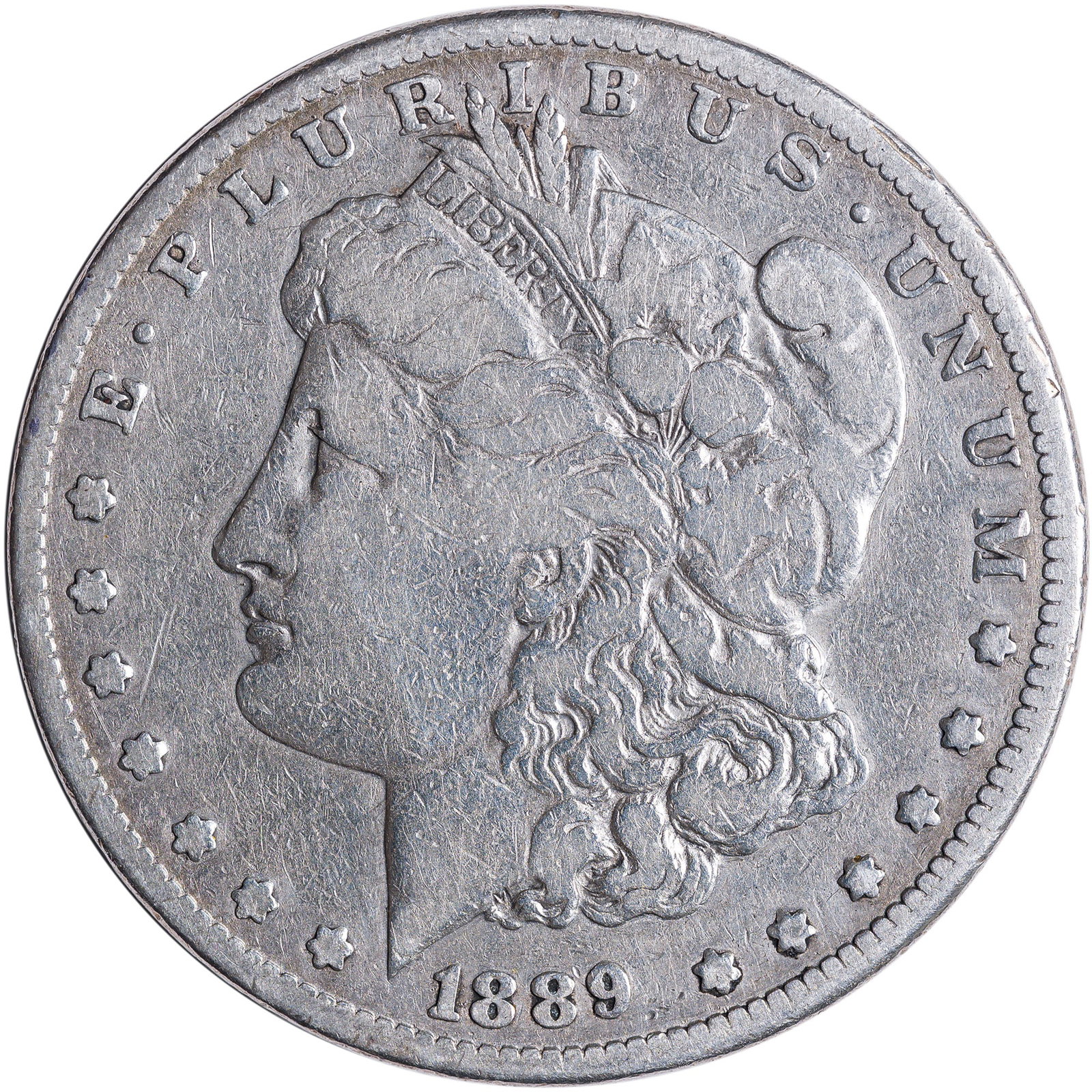 F-12 1889-CC Morgan Dollar: Perhaps lightly cleaned long ago.