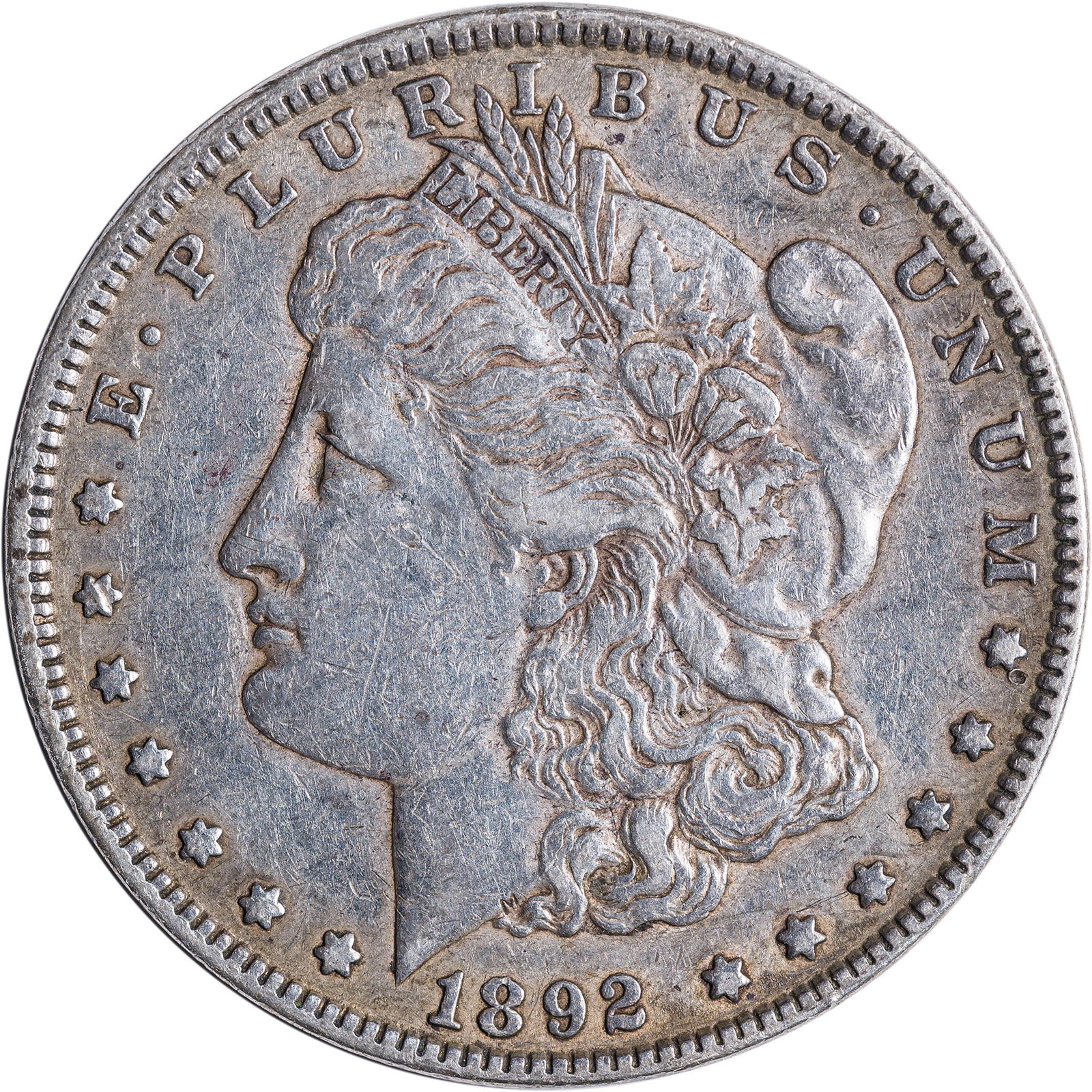 EF-40 1892 Morgan Dollar: Silvery gray with some deep golden tones at the rims.