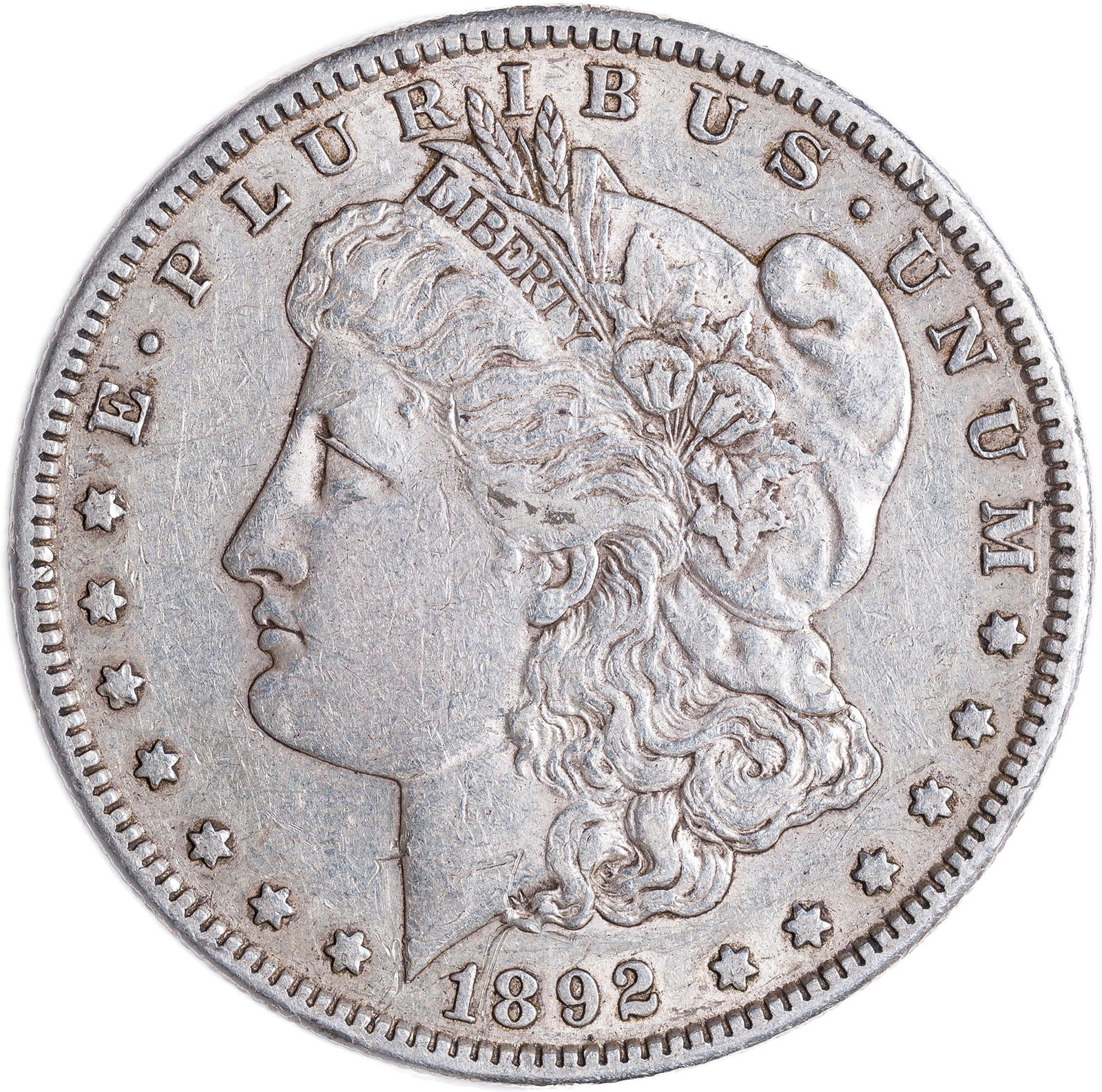 EF-45 1892-S Morgan Dollar: Mark-free and satiny golden-gray with soft retained luster in the peripheral areas.