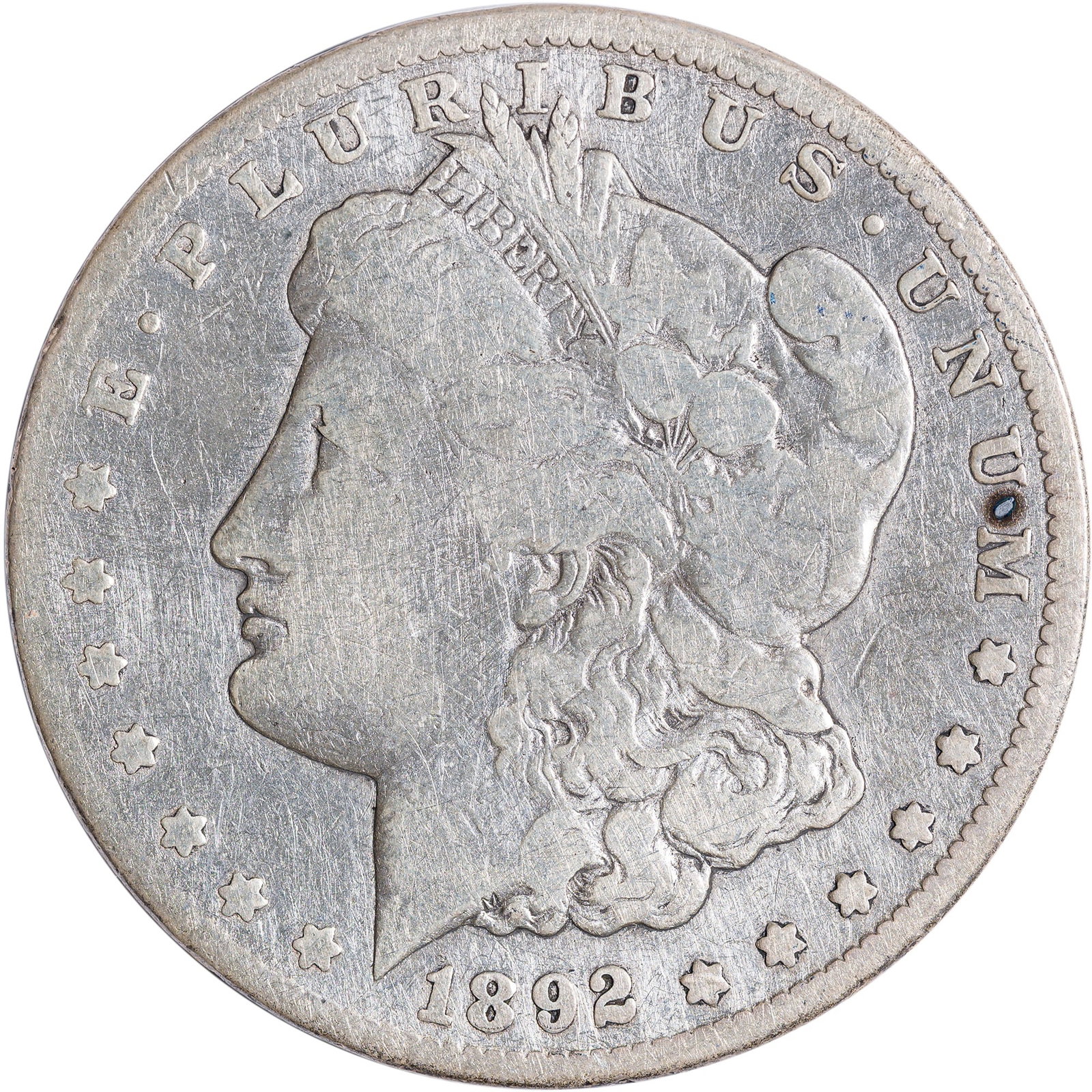 VG+ Details 1892-CC Morgan Dollar: Cleaned at some point, now golden-gray throughout.