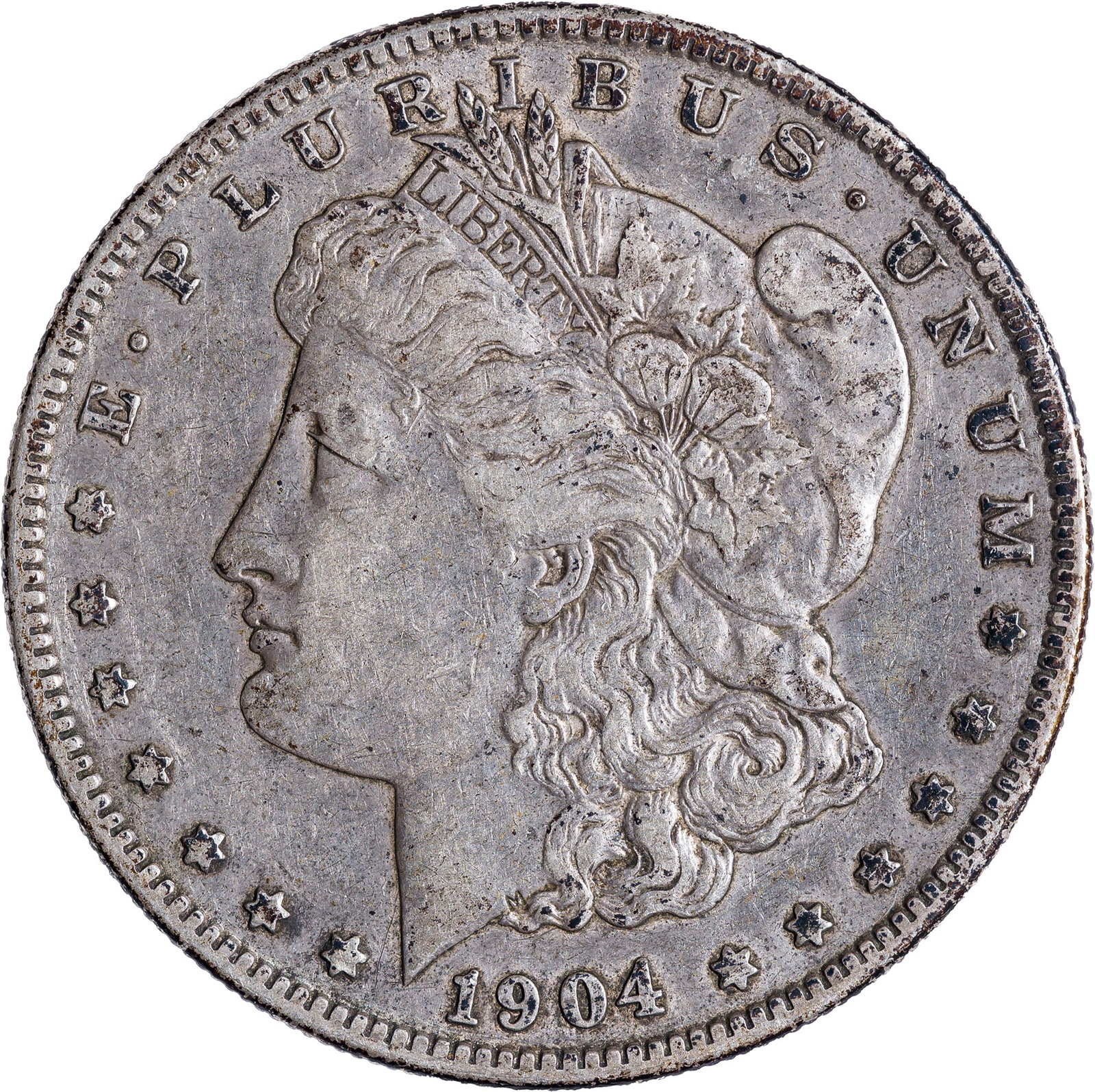 EF-40 1904-S Morgan Dollar: Steel-gray surfaces evenly circulated and mark-free save for a reverse toning spot at 5:00.