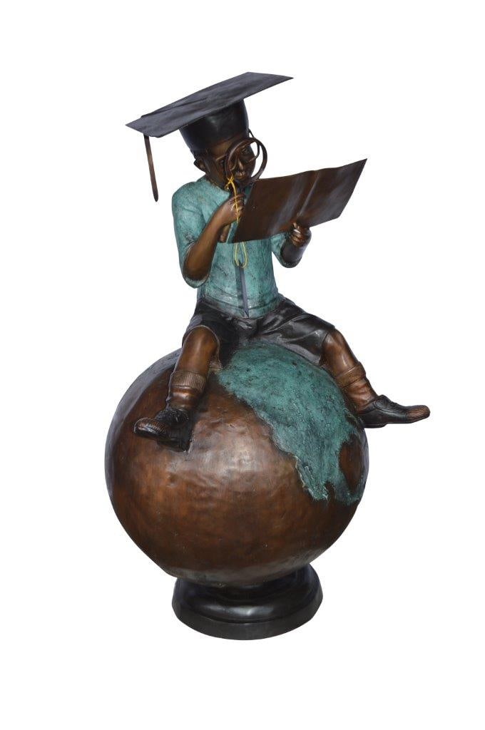 Student learning on top of world bronze statue - Size: 28"L x 24"W x 52"H.: This bronze statue is the embodiment of knowledge and the constant search for it. A young boy sits on the world while reading a book, a true metaphor. It also reminds one of the timelessness of youth