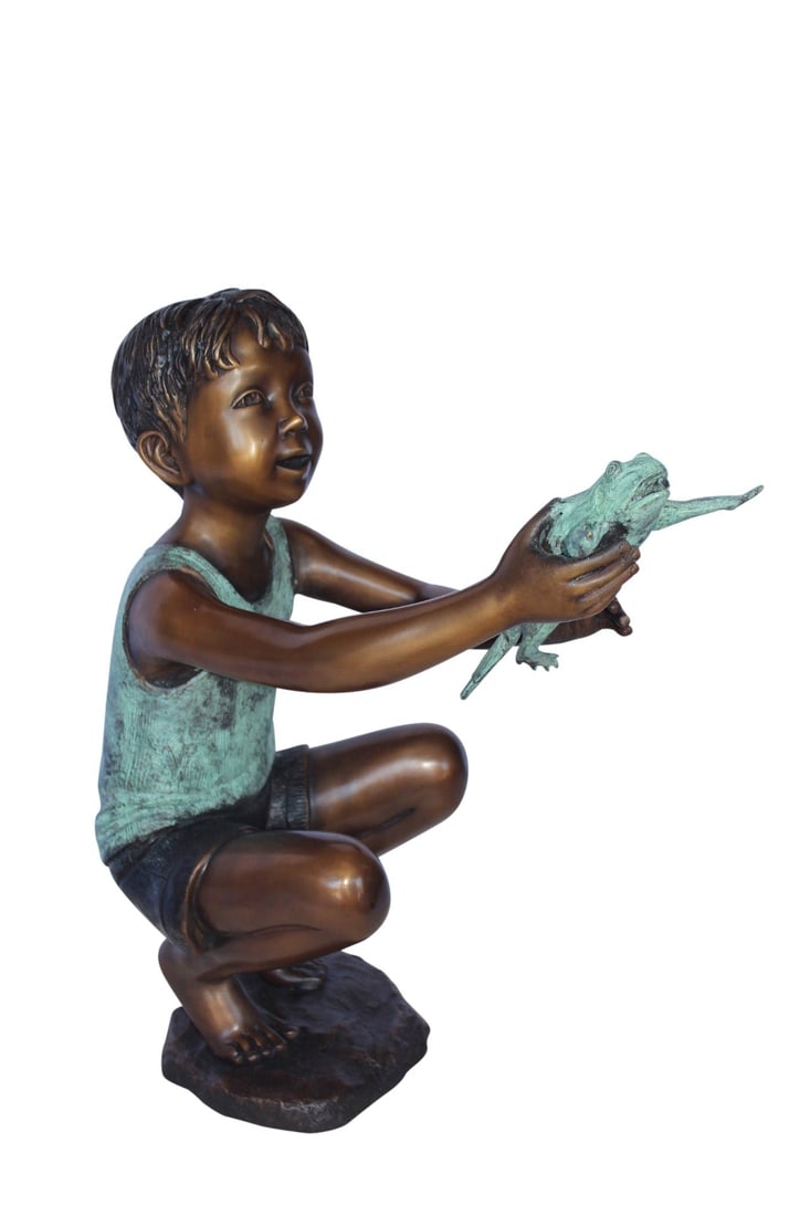 Young boy holding a frog bronze statue fountain - Size: 18"L x 10"W x 22"H.: This bronze statue fountain is a joyful adittion to any home with children. The young boy squats on the ground while holding onto a leaping frog where the fountain extends from. With the use of a foun