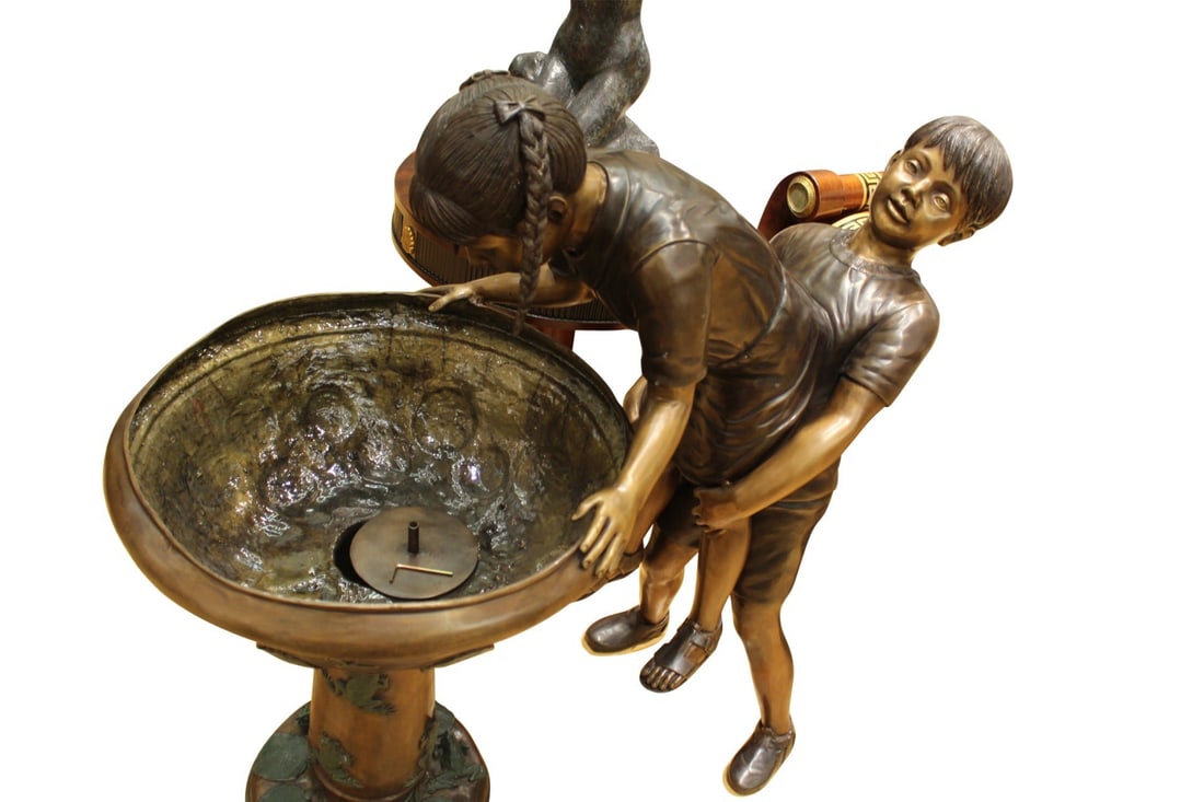 Boy Girl Drinking From Fountain Bronze Statue - Size: 44"L x 24"W x 42"H.: Two little kids take a break from playing in the park to get a refreshing drink from this outdoor water fountain. This beautiful bronze fountain sculpture is a classic addition to any outdoor space. T