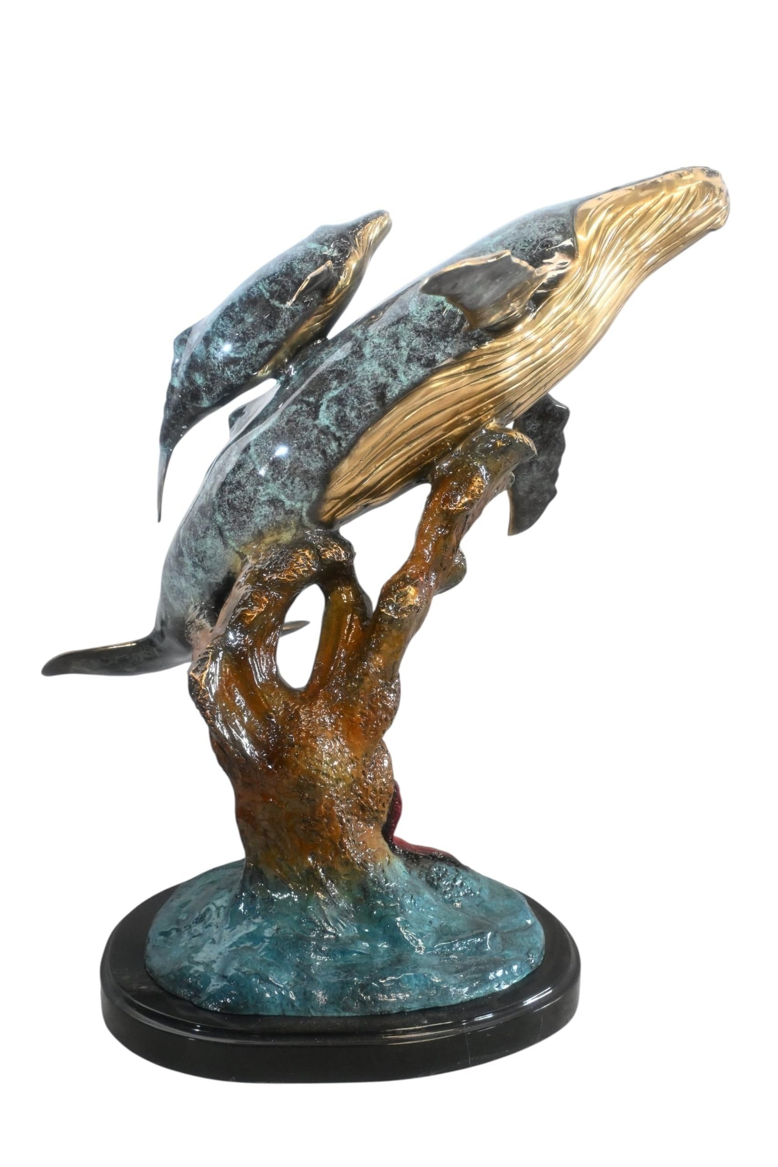 Bronze Humpback Whale Pair Sculpture Coral Branch 27"x22"x30"H: Magnificent bronze sculpture featuring two humpback whales swimming around coral branch crafted using the traditional lost wax method. This dramatic piece captures the grace and power of these ocean g