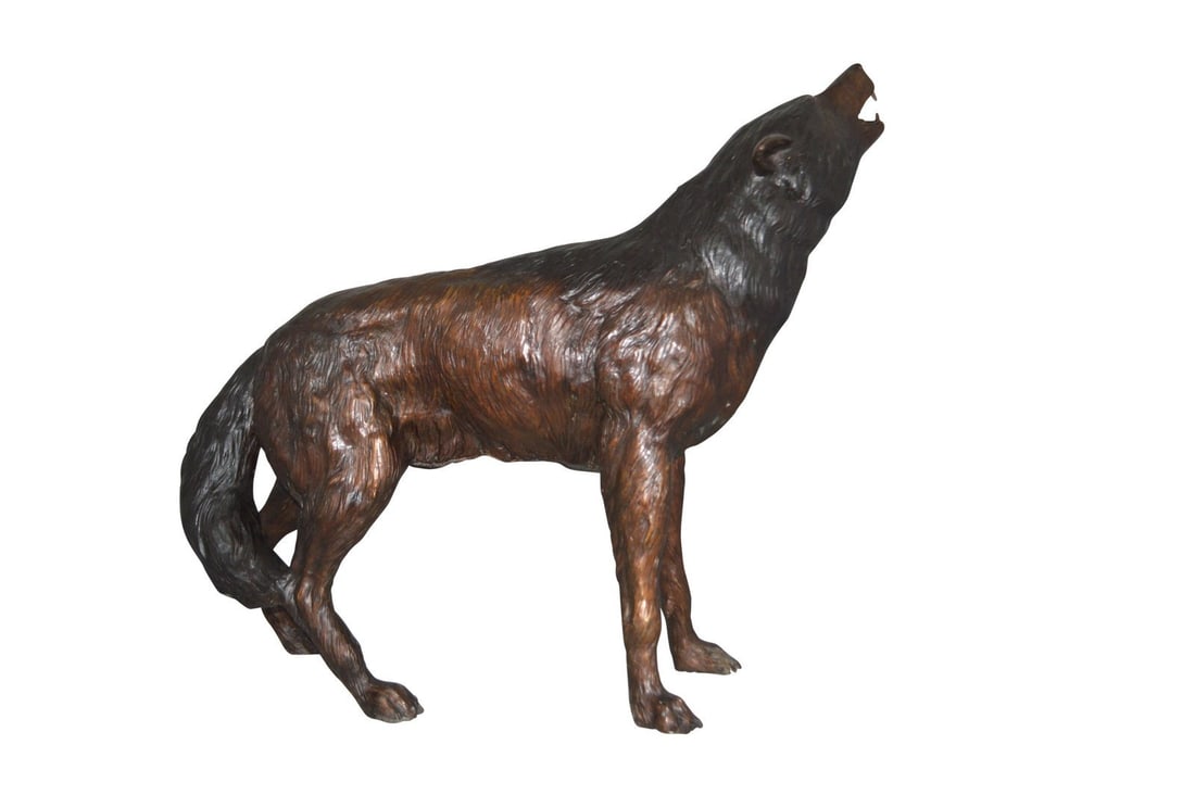 Howling Wolf Bronze Statue - Size: 40"L x 10"W x 32"H.: Standing on the ground howling at the full moon, this wolf is calling for his friends. Shown in stunning detail and mounted on beautiful black base, the statue would make for a great gift idea. Our im