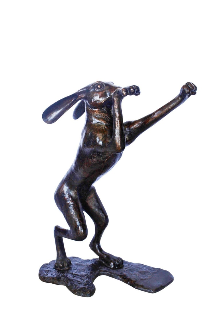 Leaping jackrabbit bronze statue - Size: 21"L x 13"W x 24"H.: This bronze statue of a jackrabbit leaping highlights the eagerness of the animal to proceed in its motion. The piece of art carries a lot of character in its shape and design. It would fit well in an