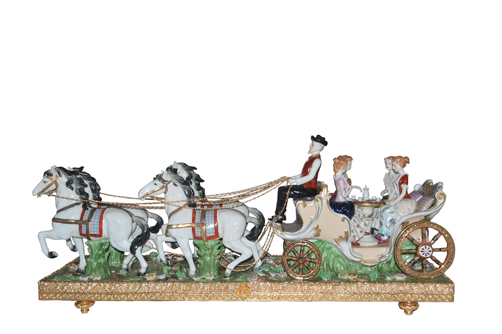 Porcelain Carriage with 4 young Girls Drinking Tea - Size: 41"L x 10"W x 18"H.: Enjoy this Impressive, classic, heavy, beautiful porcelain piece of a handsome driver leads the four horses over a grassy, flower-filled field. On the carriage are four ladies drinking tea. Made of Wh