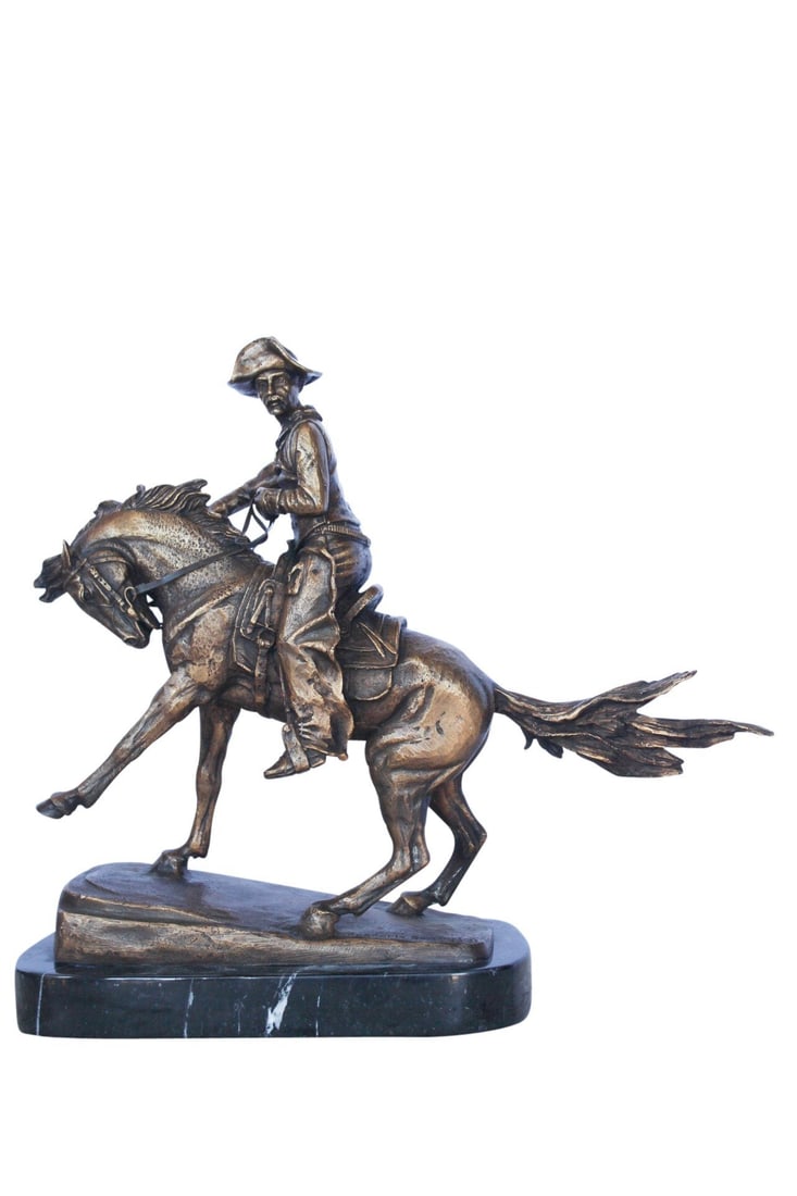 Remington replica Cowboy bronze statue - Size: 5"L x 15"W x 13"H.: This bronze statue replicates the well-known piece titled Cowboy, by famous sculptor Frederic Remington. This statue depicts the ascending strides of the horse and the far off gaze of his rider. Situa