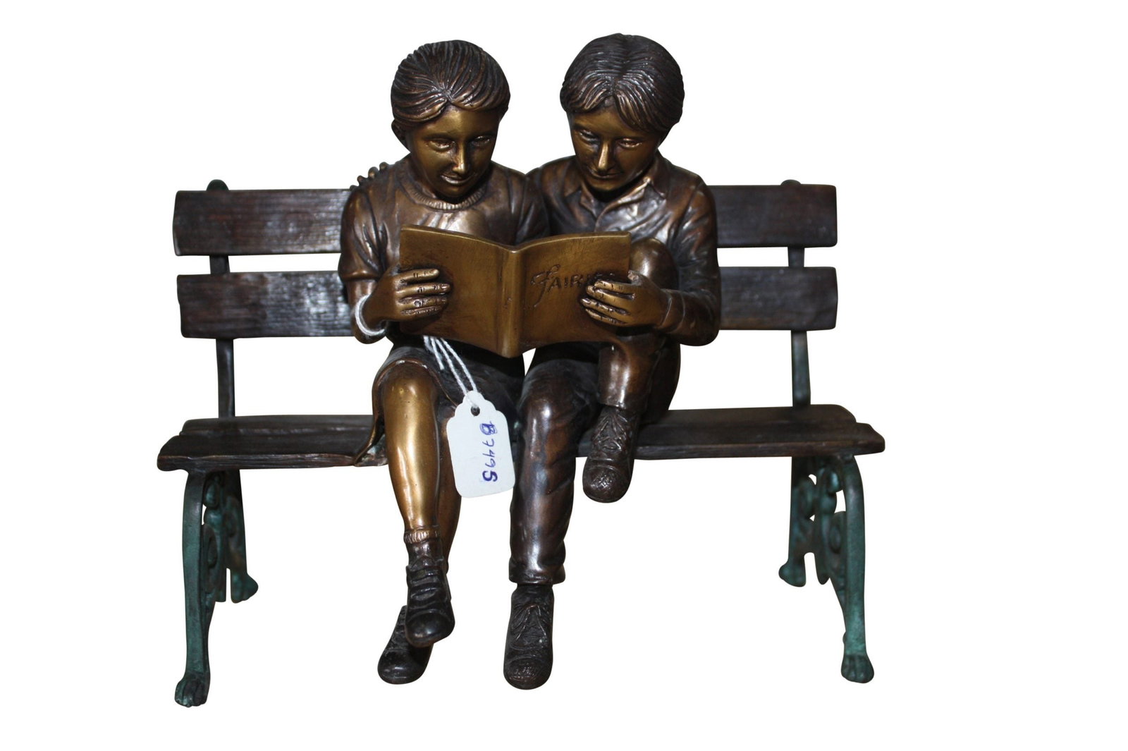 Two kids on bench reading a book - Bronze Statue - Size: 9"L x 6"W x 8"H.: This bronze statue /sculpture creates a spot for quiet reflection in the home. This whimsical and very popular statue of a boy and girl sitting on a bench reading a story brings back childhood memorie