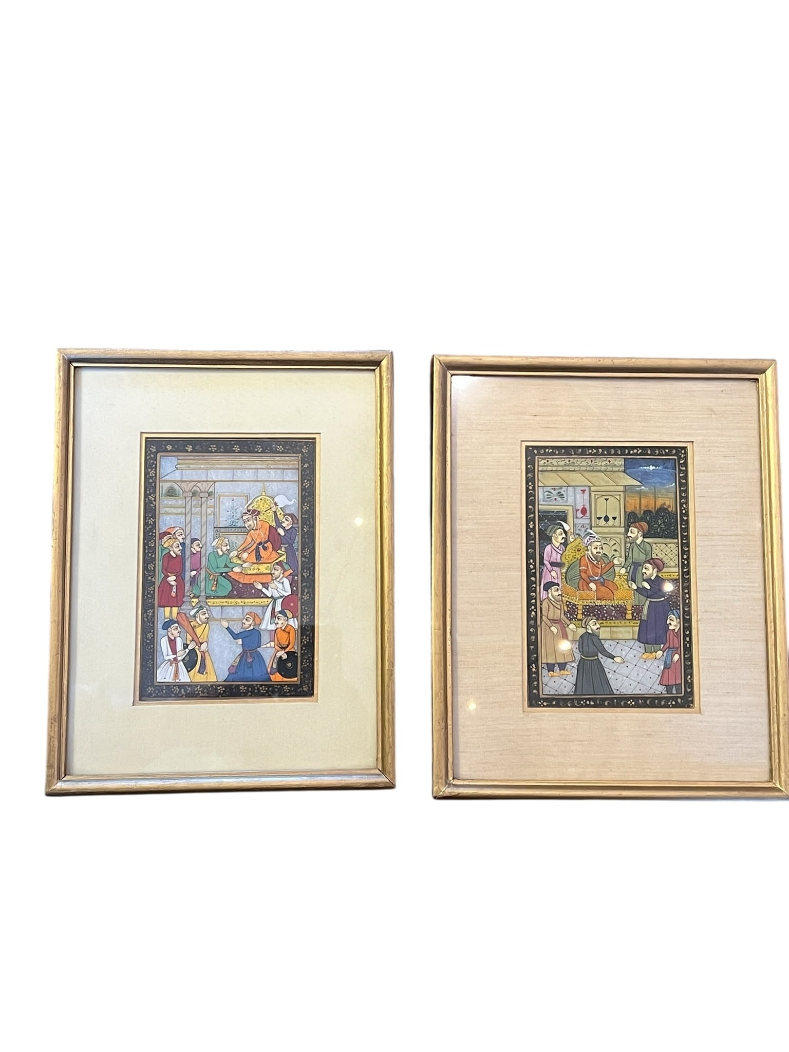 Pair of Mughal Court Paintings on Quartz: Pair of Mughal Court Paintings on Quartz. Hand Painted on quartz of the Mughal Court. Off white silk mat on one and white silk on the other. The Mughal Empire existed from approximately 1526-1858. The