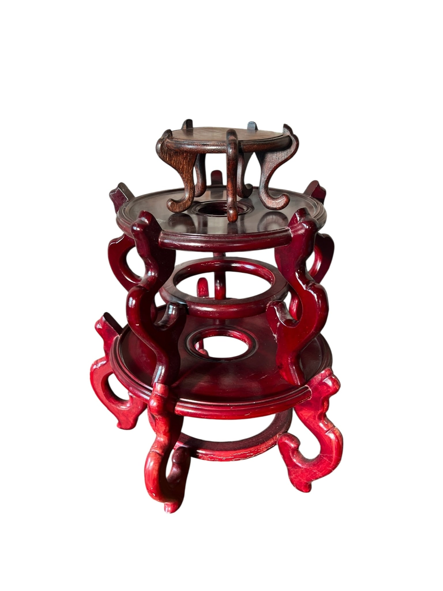 Group of 3 Asian Wood Stands: Group of 3 Asian Wood Stands. All 3 stands are in good condition and measure as follows: 10 inches wide x 6.5 inches tall; 7.5 inches tall x 9.5 inches wide; 5 inches wide x 3.5 inches tall. In House