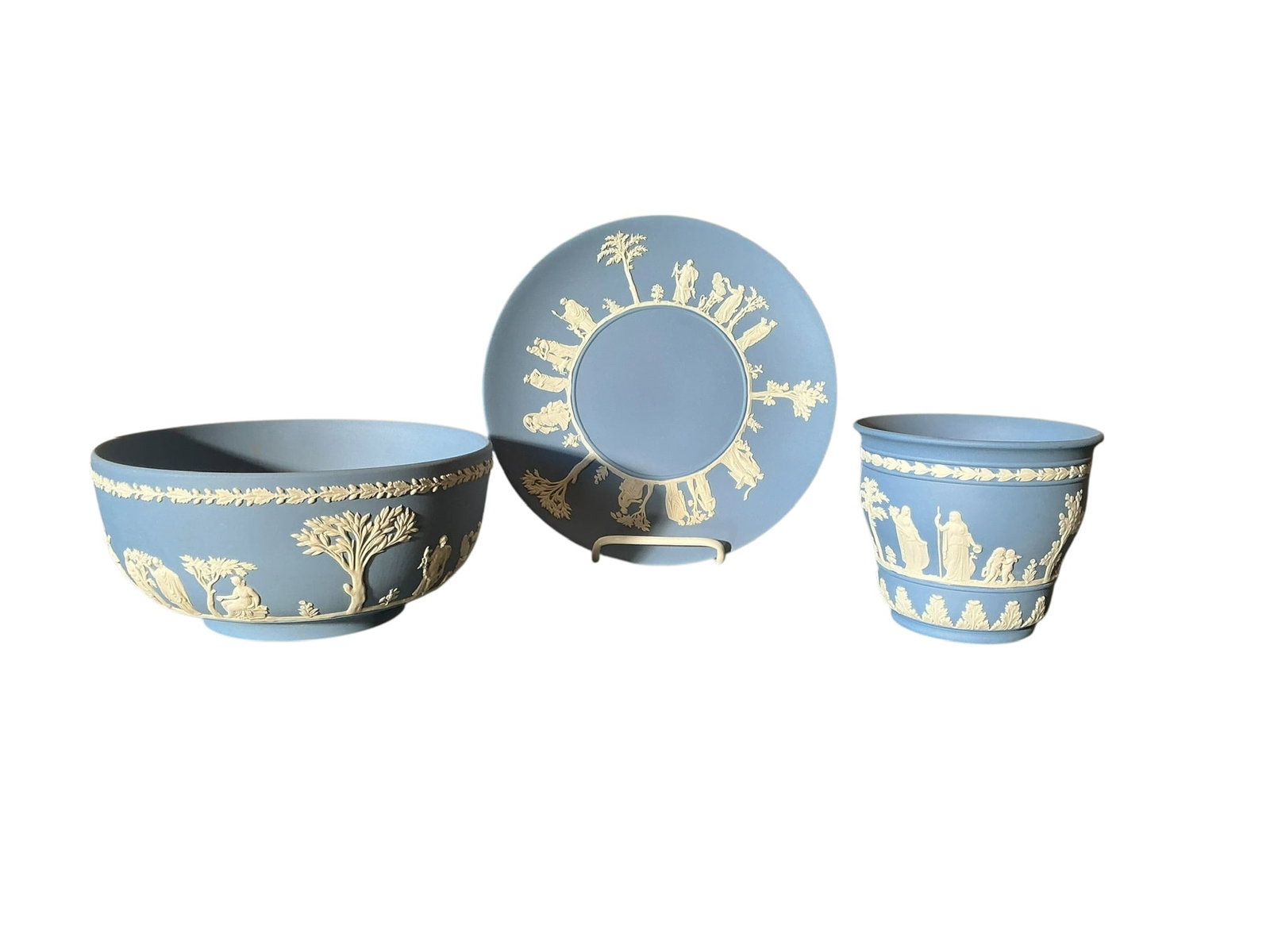 Trio of Wedgwood Blue Pottery (Jasperware): Trio Of Wedgwood Blue Pottery (Jasperware). Vintage Wedgwood blue pottery including large plate measuring 9.5 inches. The large bowl measures 3.75 inches tall x 8 inches wide. The small planter is 4 i