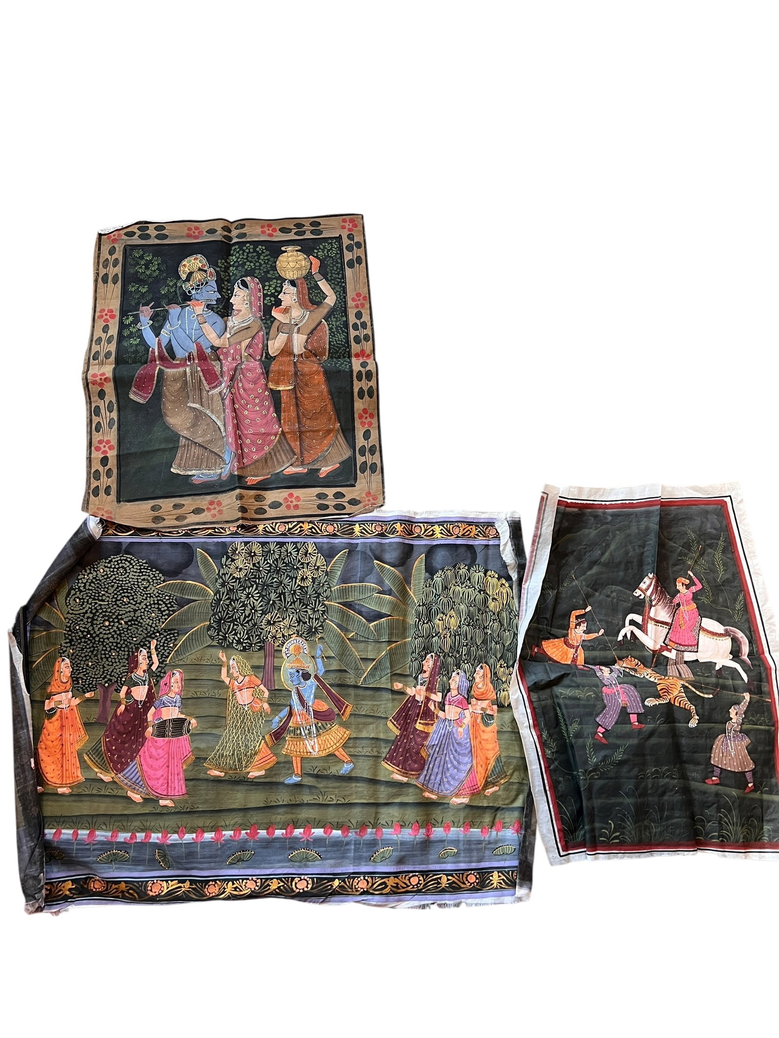 Grouping of 3 Fabric Painted Artworks: Grouping of 3 Fabric Painted Artworks. Includes one 15.25-inch x 20.25-inch Tiger Hunt. One of Lord Krishna playing the flute, measuring 17 inches x 21.75 inches. One lord Krishna and Gopikas scroll m