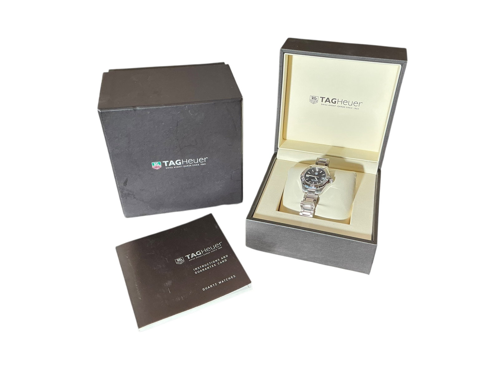 Tag Heuer Ladies Aquaracer Wrist Watch: Tag Heuer ladies Aquaracer wristwatch. Watch is currently not running. Appears to be unworn. 32 MM Steel. WAY1310. Quartz movement. Comes with original box, paperwork and extra links. In House shippin