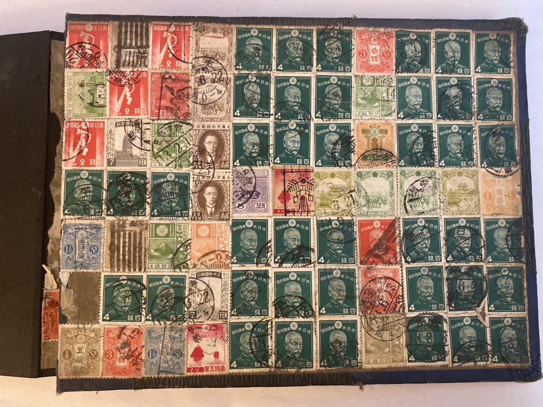 WW2 Japanese Stamps Photo Album: This World War II Japanese photo album is a remarkable piece of history, offering a unique glimpse into the past. The album features an exquisite collection of Japanese stamps on its inside covers. Th