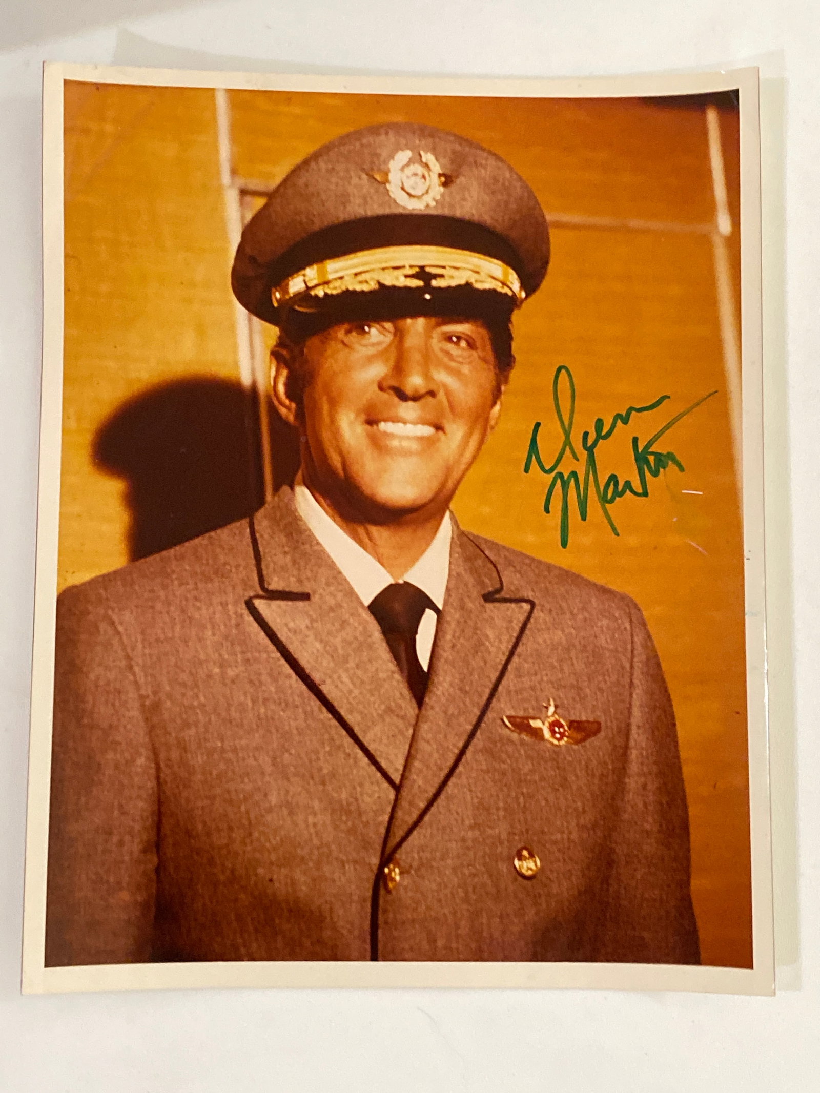 Dean Martin Autographed Photo: This auction offers an exquisite 8x10 autographed photo of the legendary entertainer Dean Martin. Known as the "King of Cool," Dean Martin's career spanned music, film, television, and stage, making h