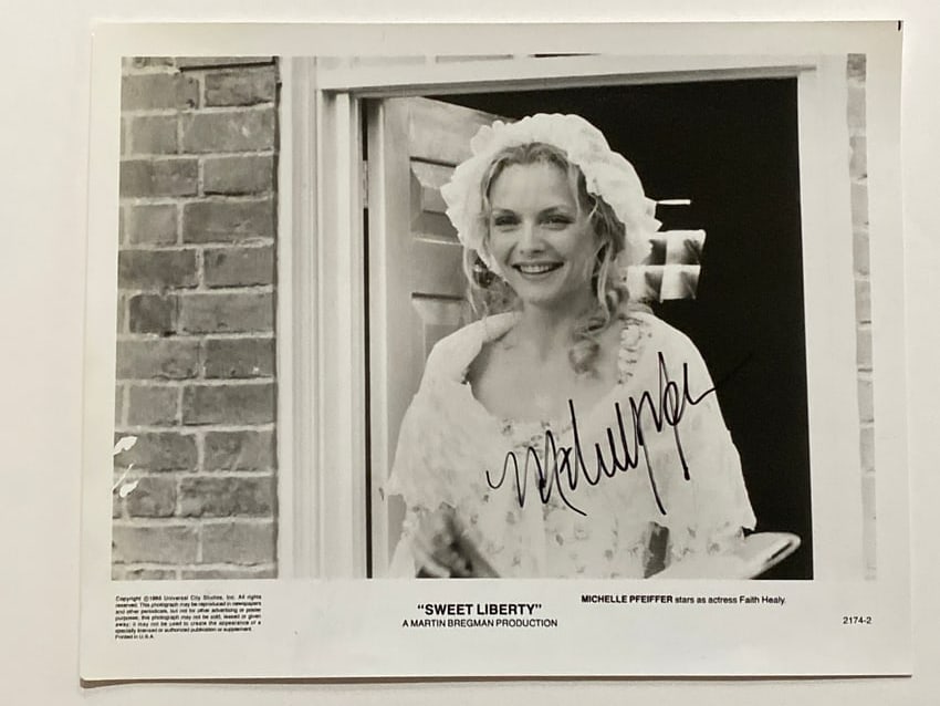Michell Phiffer Autographed Movie Photo: This auction features a stunning 8x10 autographed photograph of Michelle Pfeiffer, capturing the timeless elegance and talent of one of Hollywood's most iconic actresses. Known for her memorable roles