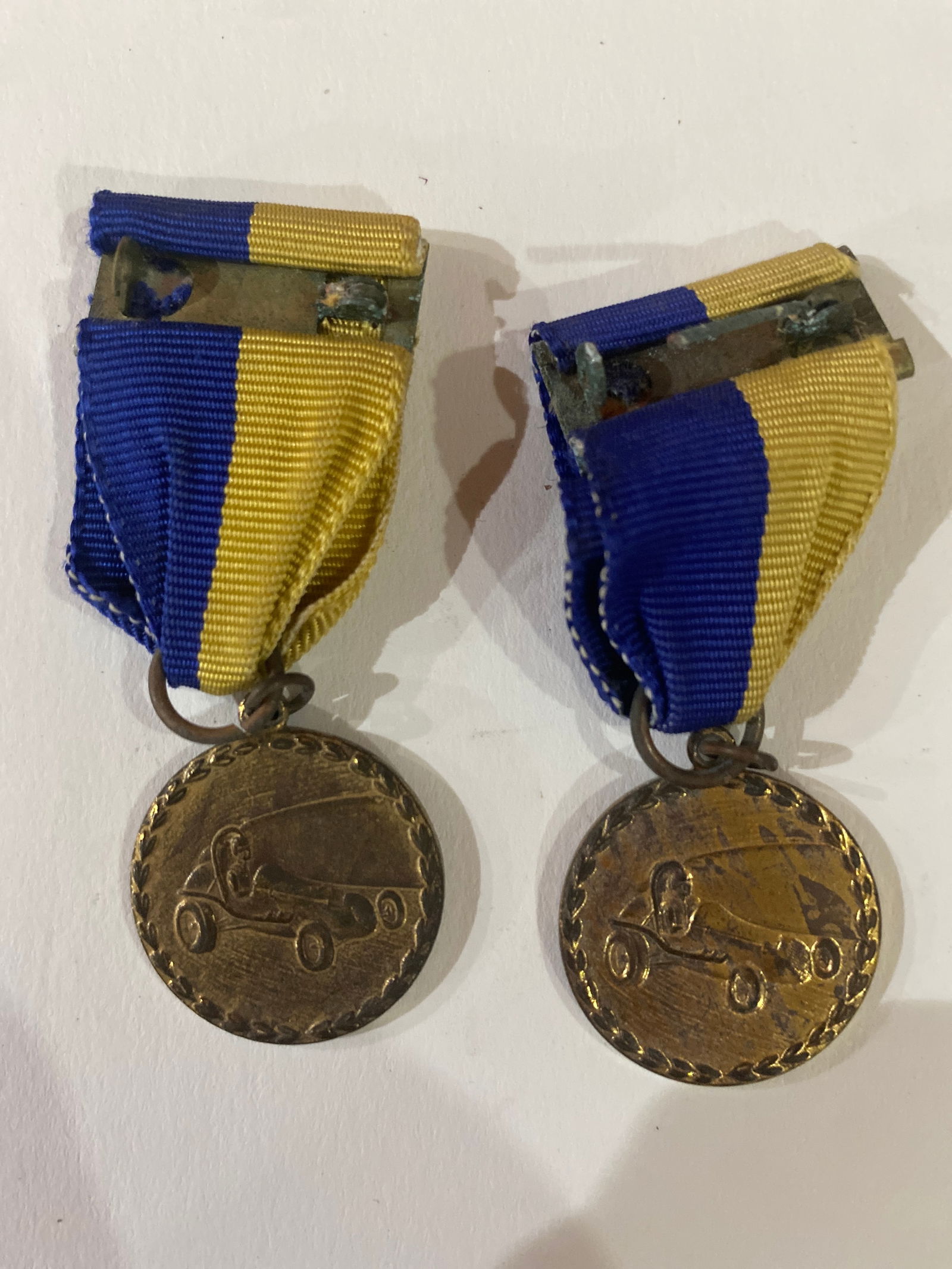 Vintage Boy Scouts of America Pinewood Derby Medals: This set of Vintage Boy Scouts of America Pinewood Derby Medals is a nostalgic tribute to the cherished tradition of creativity, competition, and craftsmanship. Each medal showcases intricate designs