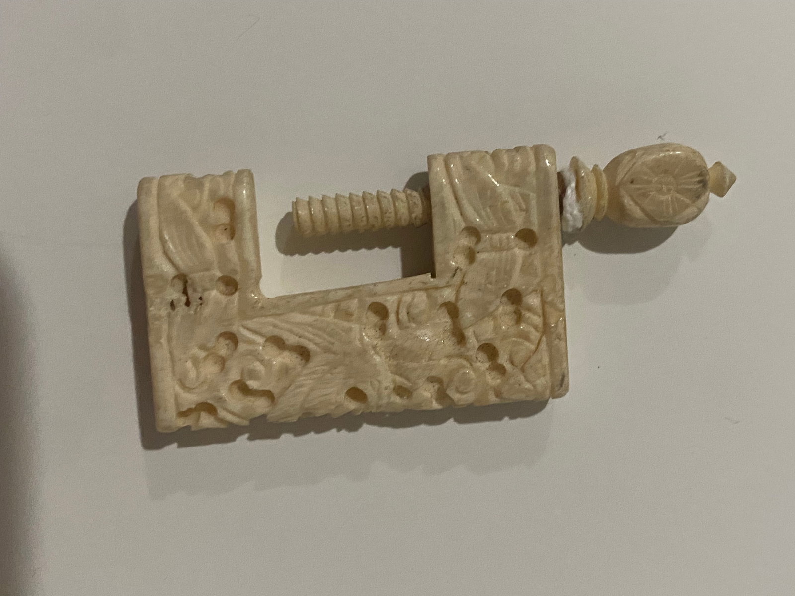 Antique Asian Chinese Clamp Tool: Antique Asian Chinese clamp tool meticulously carved from genuine tusk, measuring 2.25 inches long. This rare and unique piece combines functionality with exquisite craftsmanship, showcasing intricate