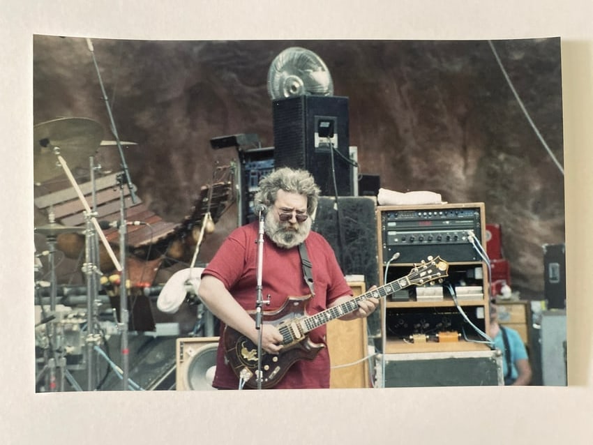 Jerry Garcia Grateful Dead Red Rocks Original Jay Blakesburg Photo: Offered here is an original photograph of Jerry Garcia, captured by renowned rock photographer Jay Blakesberg at the legendary Red Rocks Amphitheatre during a Grateful Dead performance. Blakesberg, ce