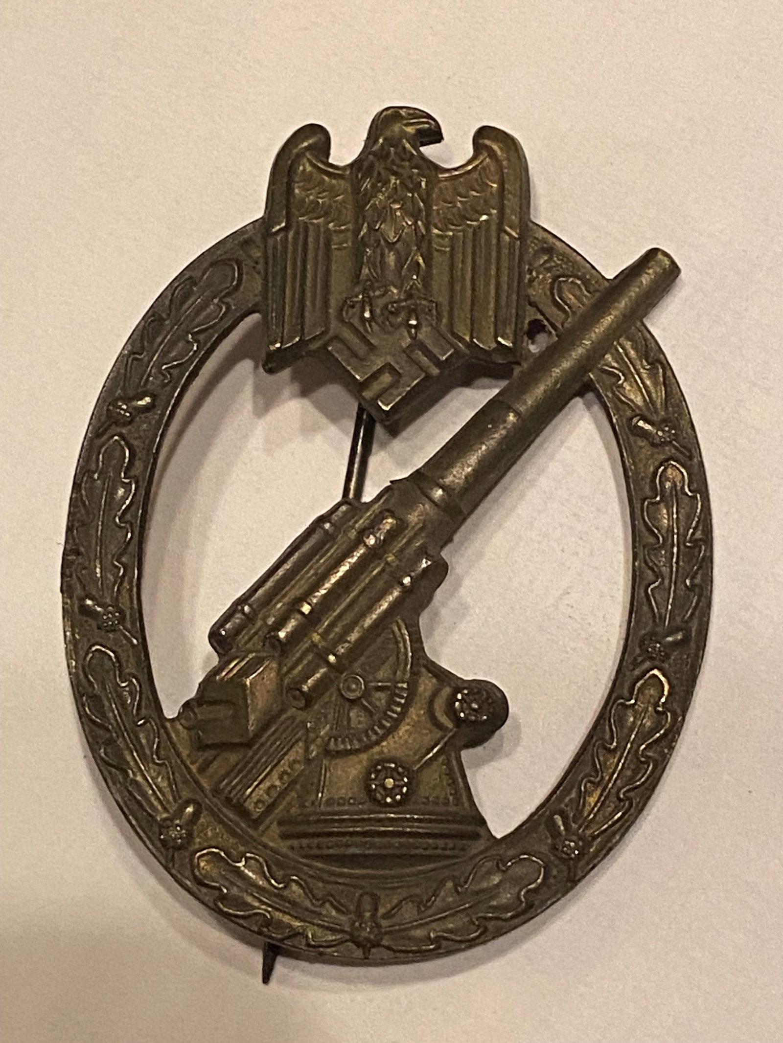World War 2 German Nazi Anti Aircraft Medal: A historically significant WWII-era German Luftwaffe Flak Badge awarded to soldiers who demonstrated exceptional skill and bravery operating anti-aircraft guns defending against Allied air raids. The 