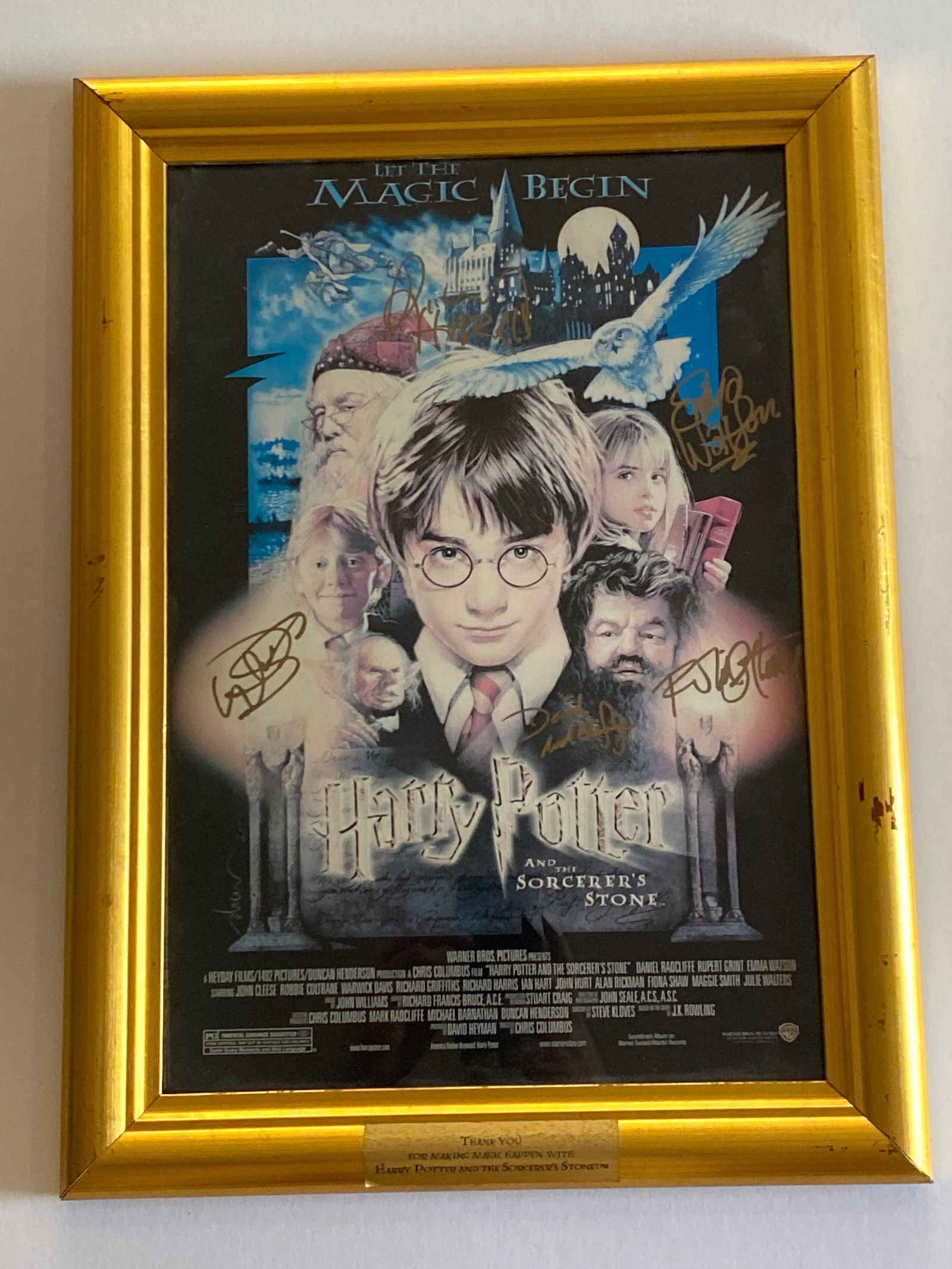 Harry Potter and The Sorcerers Stone Cast Signed Poster: Poster from Harry Potter and the Sorcerer's Stone, the 2001 first film in the Harry Potter series directed by Chris Columbus and based on J.K. Rowling's novel. Signed by the the main screen cast