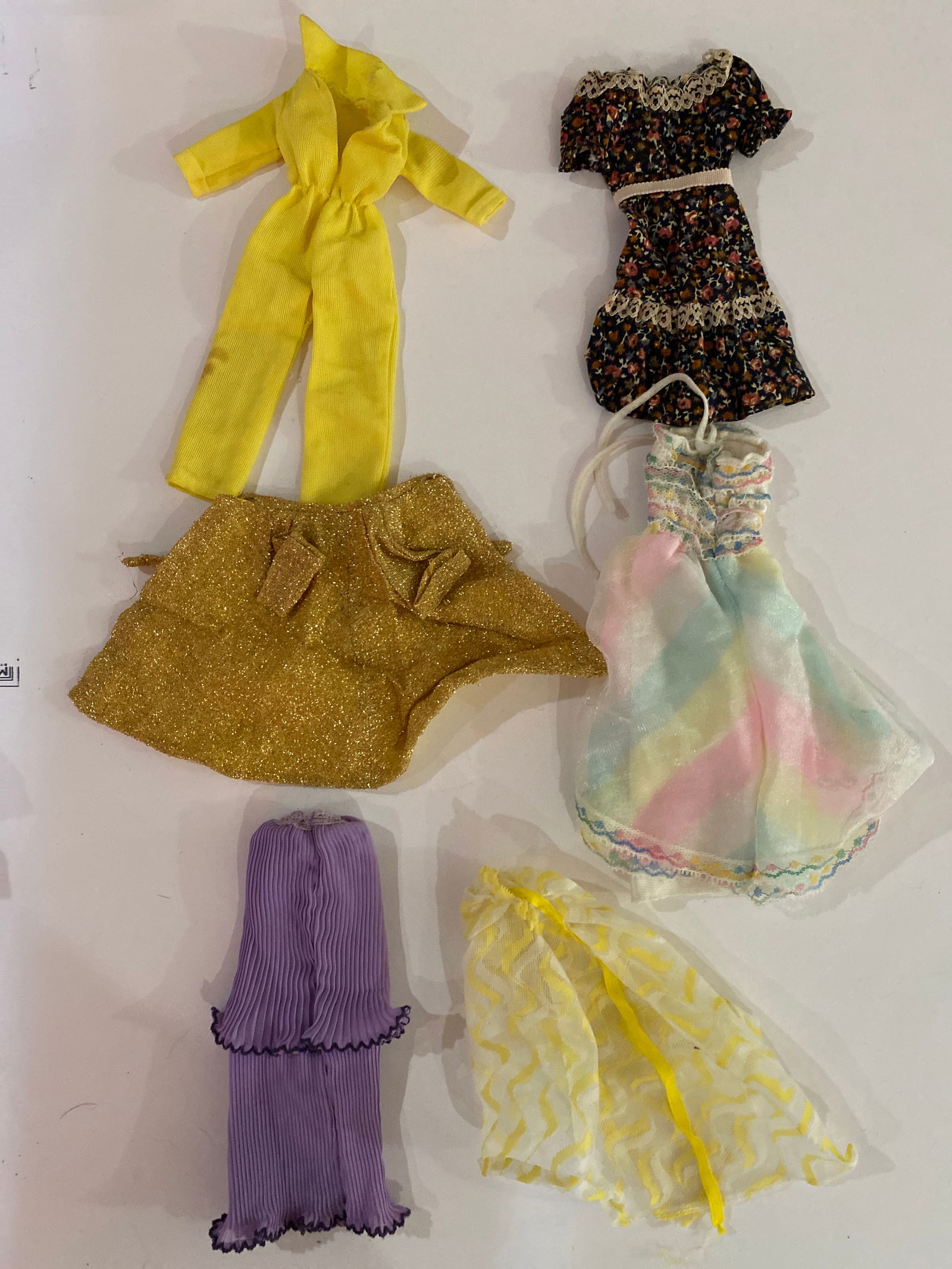 Vintage Barbie Doll Clothing Lot: Lot of vintage Barbie doll clothing and outfit pieces produced by Mattel. Unknown dates