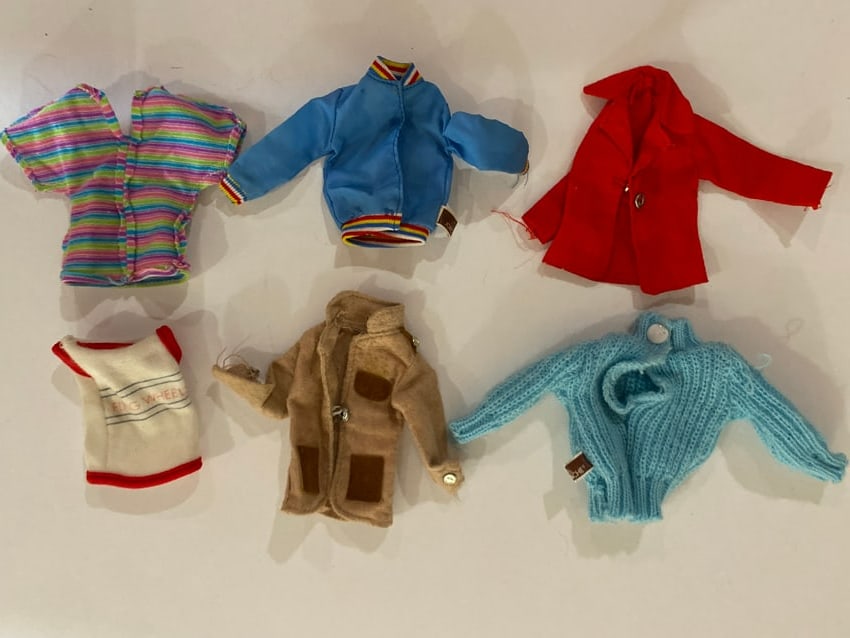 Vintage Barbie Doll Jackets and Sweaters Lot: Lot of vintage Barbie doll jackets and sweaters designed for Barbie fashion dolls by Mattel. These miniature garments reflect the mid- to late-20th-century popularity of mix-and-match Barbie wardrobe