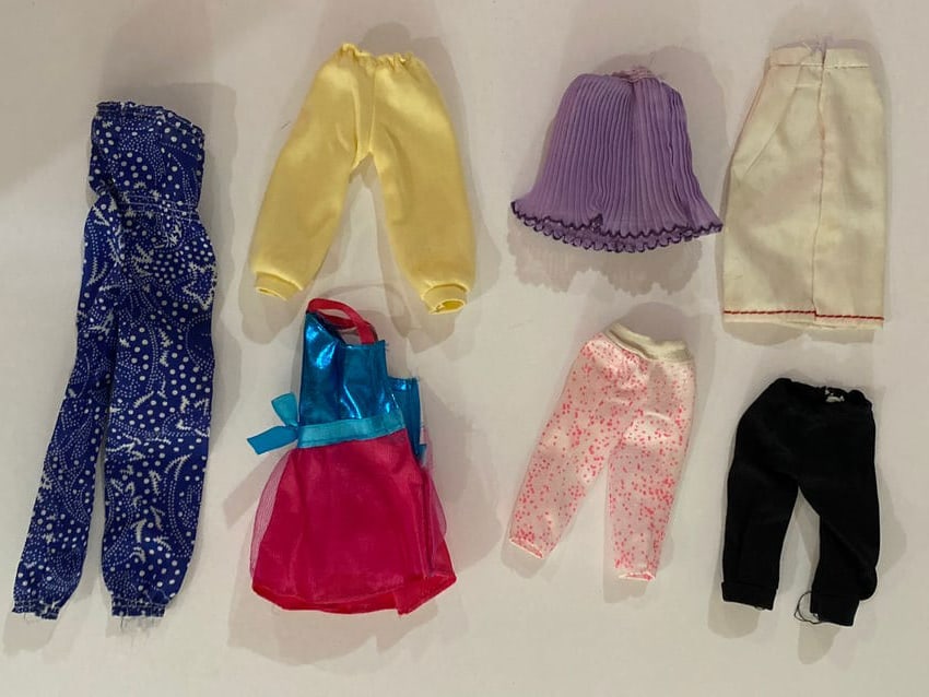 Vintage Barbie Doll Skirts and Pants Lot: This lot includes a group of vintage Barbie doll skirts and pants designed for Mattel Barbie fashion dolls. Clothing pieces such as these were produced in a variety of fabrics and styles beginning in
